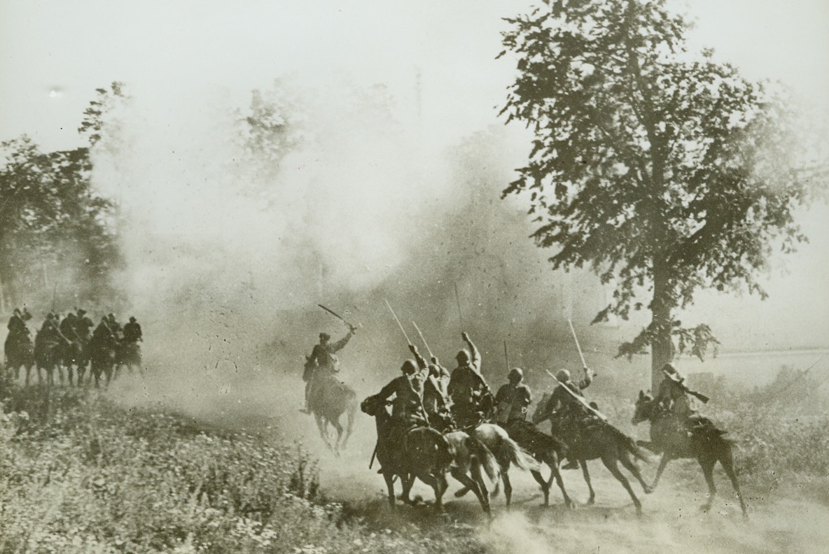 COSSACKS-RUSSIAN’S OLDEST AND FIERCEST, 2/2/1943. SOMEWHERE IN RUSSIA—A unit of Cossacks advance upon a village in the Don valley, occupied by enemy forces. With battle cries of old and weapons of 1943, the famous cavalrymen are among the fiercest of the Red fighters who are turning back the Nazis on all fronts.Credit: ACME.;