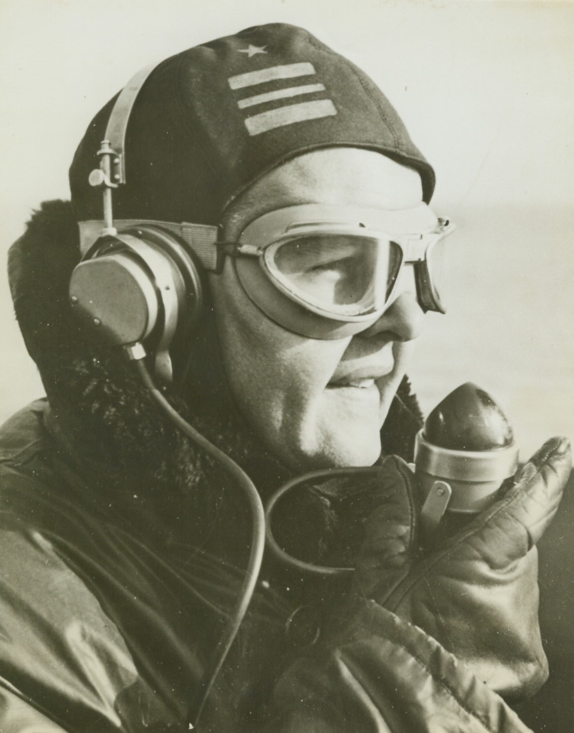 Enemy Overhead, 2/3/1943. Enemy Overhead – From the Sky Lookout, the top-most platform of a battleship, a U.S. Navy officer directs the fire of a 40 mm. and 20 mm anti-aircraft guns, during a cruise and target practice run. The Lieutenant Commander coordinates the defense fire against attacking enemy planes coming in simultaneously from several directions. Credit: Official U.S. Navy photo from ACME;