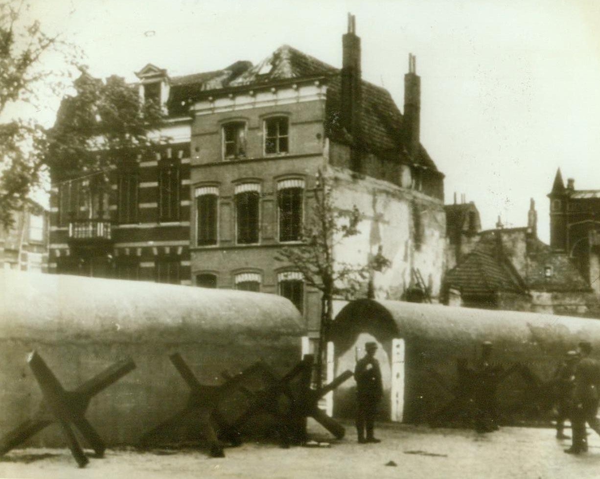 PART OF HITLER’S FORTRESS, 5/21/1943. CHANNEL COAST – As the Nazis get more and more jittery at the thought of a possible Allied invasion of Europe in the near future, their coastal defenses are being strengthened at a more feverish pace. Here’s an anti-tank wall in the harbor area of an unnamed city on the Channel coast, according to the German caption received by radio this morning from Stockholm Credit Line (ACME Radiophoto);