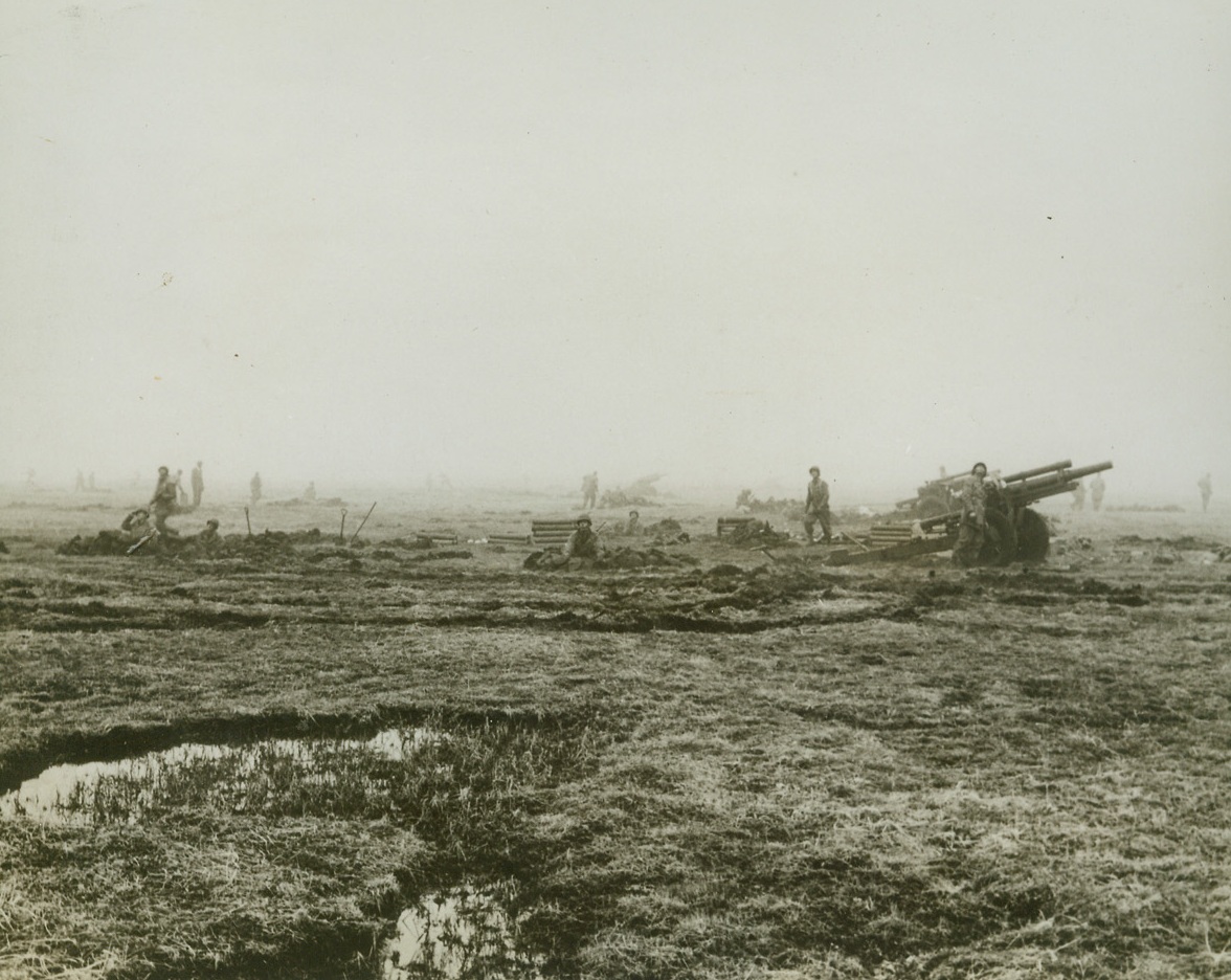 Eyes Up!, 5/27/1943. Attu—All eyes focus anxiously on the Aleutian skies as American fighting men watch their air arm fly into battle.  The guns, of course, are focused on the Japs in the hills of Attu as U.S. troops begin operations on that Westernmost island of the Aleutian chain.  Latest reports from Attu indicate that the island’s rough, rocky terrain may delay the final Allied push against the Japs.Credit Line (Official U.S. Navy photo from ACME);