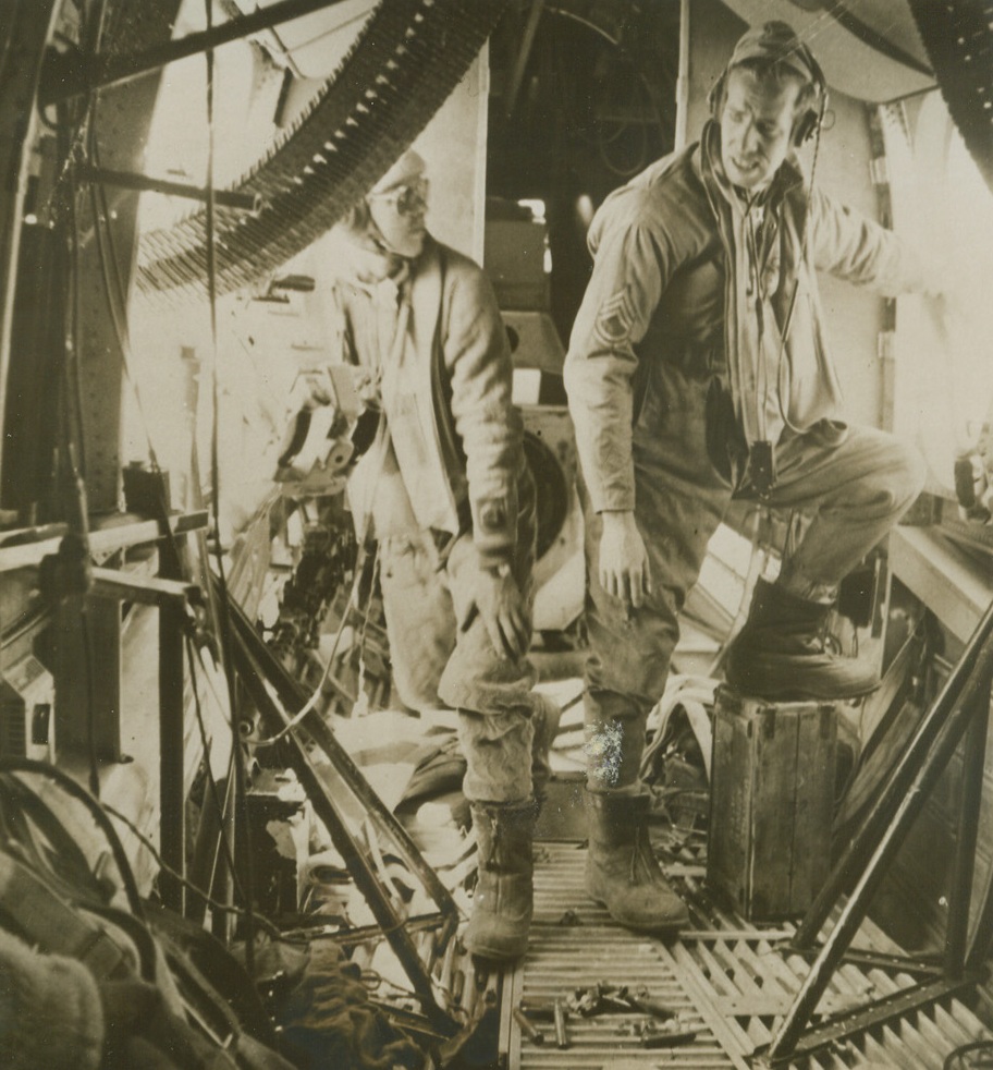 Liberator Bomber Calls on Italy, 6/27/1943. The story of an action-packed ten-hour flight of a formation of Liberator bombers that winged from a Libyan airport to blast Grottagli, Italy, is told in this series of pictures. Aside from the high altitude chill, the photographer’s main difficulty was keeping out of the way of battling waist gunners in the Liberator he rode. A formation of 12 German Messerschmidt 109’s attacked the U.S. bombers of the Army Air Force and were beaten off. Here are some of the high spots of the recent raid. New York BureauTwo waist gunners let out a deep breath and compare notes on the trouncing they just gave German planes. They are T/Sgt. H.M. Conlee (left), of Mord, Ore. And T/Sgt H.M. V.F. Wachs, of Pittston, Pa. Credit: ACME.;