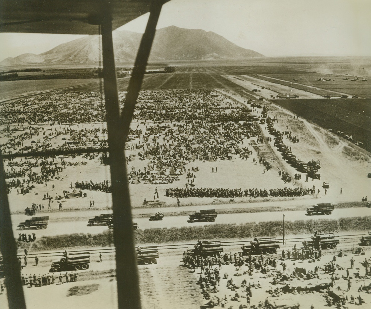 The Song is Ended, 6/10/1943. Tunisia—Their song of Axis supremacy ended, these German and Italian prisoners, captured in Northern Tunisia, are herded together on hill 609, where some of the bitterest fighting of the Tunisian campaign occurred. Tho’ the melody lingers faintly on other fronts, these “supermen” are aware that Hitler’s war song is nearing its end. Credit: Official U.S. Army photo from ACME.;