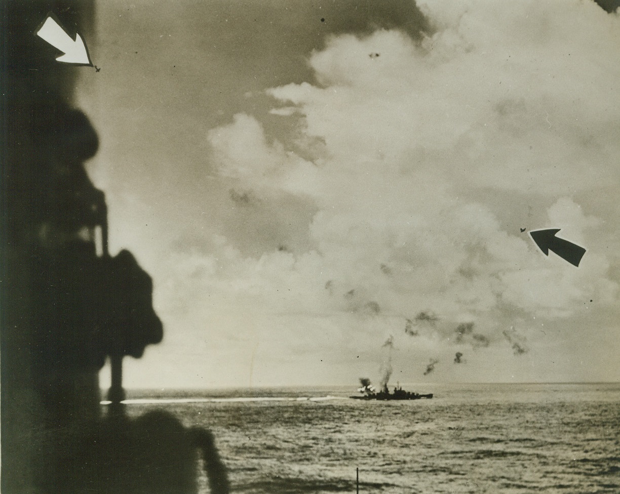 The Juneau Fights Back, 1/26/1943. Her after batteries blazing, the USS Juneau demonstrates her fighting qualities during a Japanese air attack in the battle of Santa Cruz islands, October 26, 1942.  Less than a month later, in the battle of Guadalcanla, November 13-15, the Juneau was sunk by enemy action.  The picture indicates that a bomb dropped by the plane headed for cloud protection at right fell off the port side of the Juneau, which is concentrating fire on the bomber just starting its dive at the left. Credit line (Official U.S. Navy photo from ACME);