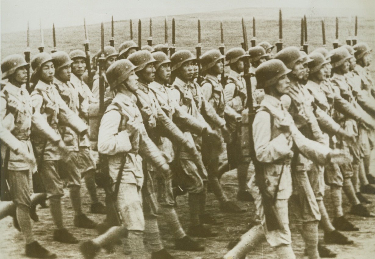 Anniversary of Chinese Revolution, 1/6/1943. Changtu, China – Chinese infantrymen march in a parade held to commemorate the 31st anniversary of the Chinese revolution and the birth of the Chinese Republic.  The parade was held in Changtu, capitol of the Province of Szechwan, which is the center of Chinese resistance to Jap invaders at the present time. Credit line (ACME);