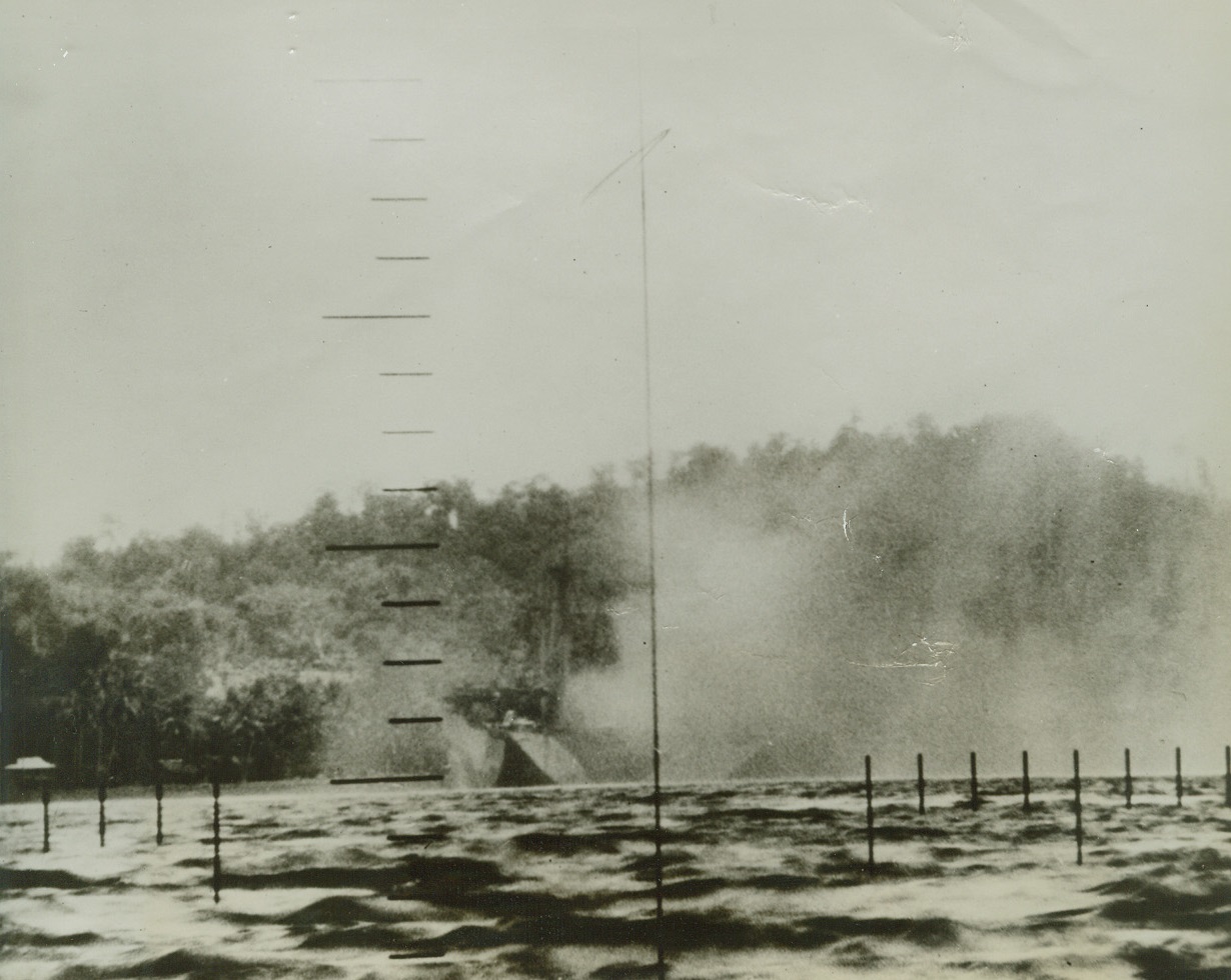 American submarines attack Japanese shipping, 1/23/1943. Attrition in Pacific waters.  Blasted by U.S. torpedoes, a Japanese ship makes her death plunge in a choppy sea.  A photographer aboard the attacking submarine snapped this graphic picture through the periscope just as the stern of the stricken ship lifted up from the surface to silhouette against the sky. Credit line (US Navy official photo from ACME);