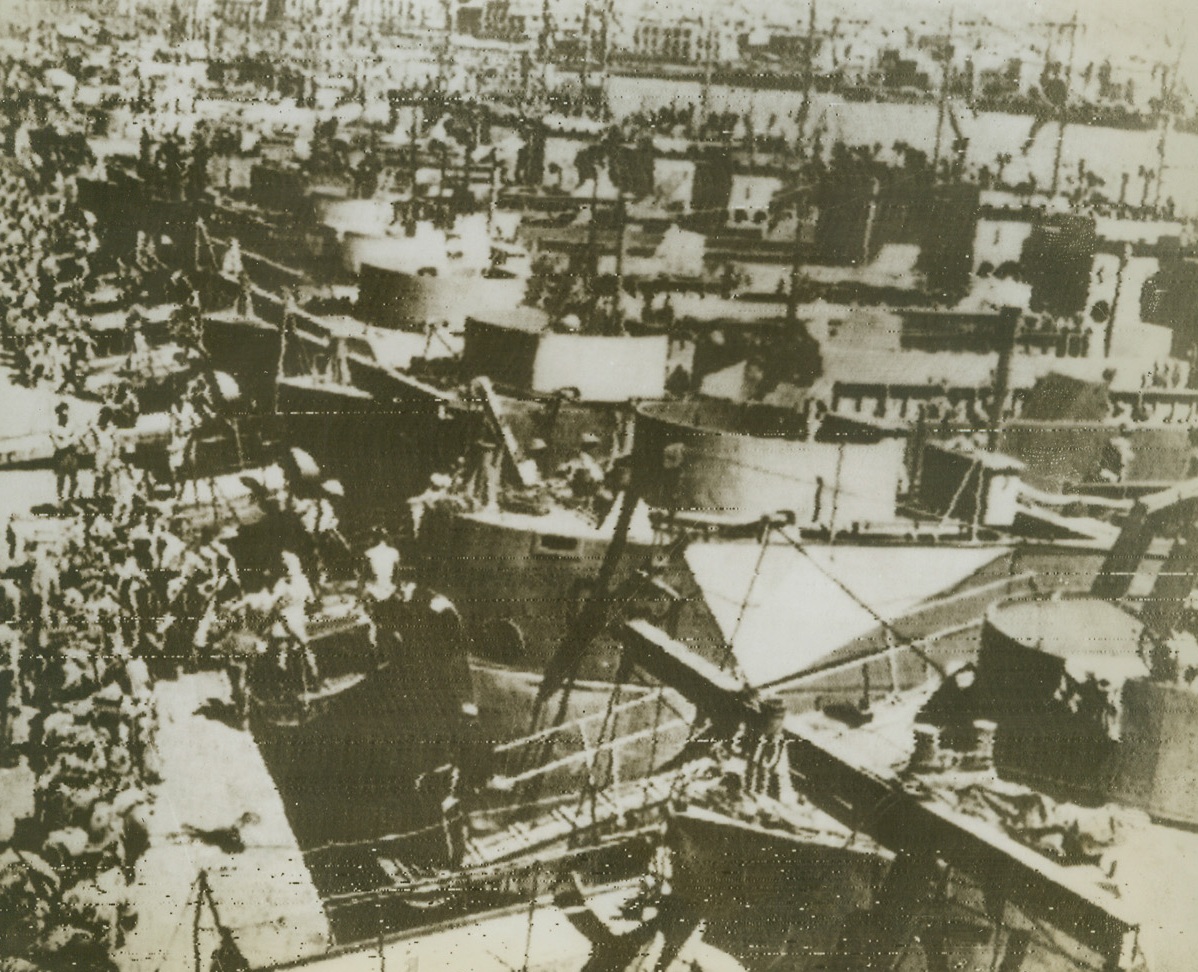 Take-off for Italy, 9/5/1943. SICILY – A Sicilian port is a solid mass of landing boats as the Allies stream on board ready to shove off for Italy. Men, tanks, jeeps and guns were amassed, ready to engulf the Southern tip of Italy under a protective aerial umbrella.Credit (Acme Radiophoto);