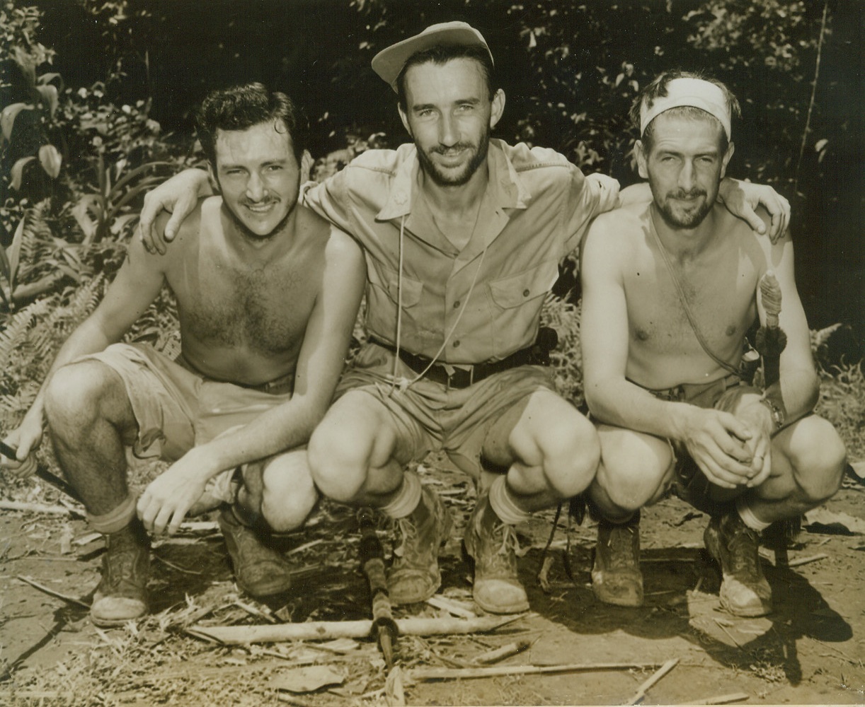 Title Illegible, 9/28/1943. India: - …aides Sgt. Richard Passey (left), Provo, Utah and Cpl. William G. McKenzie, Detroit, Mich., parachuted from a rescue plane to aid the survivors of the ATC plane crash in Northern Burma.  The party faced no land before reaching safety again. Credit (photo by Frank Cancellare, War Pool photographer, from ACME);