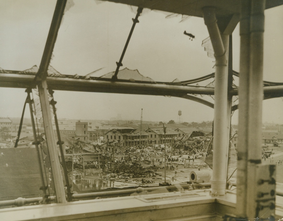 Blast Damage at Norfolk, 9/19/1943. Norfolk, Va—Here is the wreckage at Norfolk Naval Air Station, caused by the blast that shook the base on September 17th. Twenty five died, 250 were injured and a number of hangars and buildings were ruined in the explosion and the fire that followed it. Credit: Official U.S. Navy photo from ACME.;