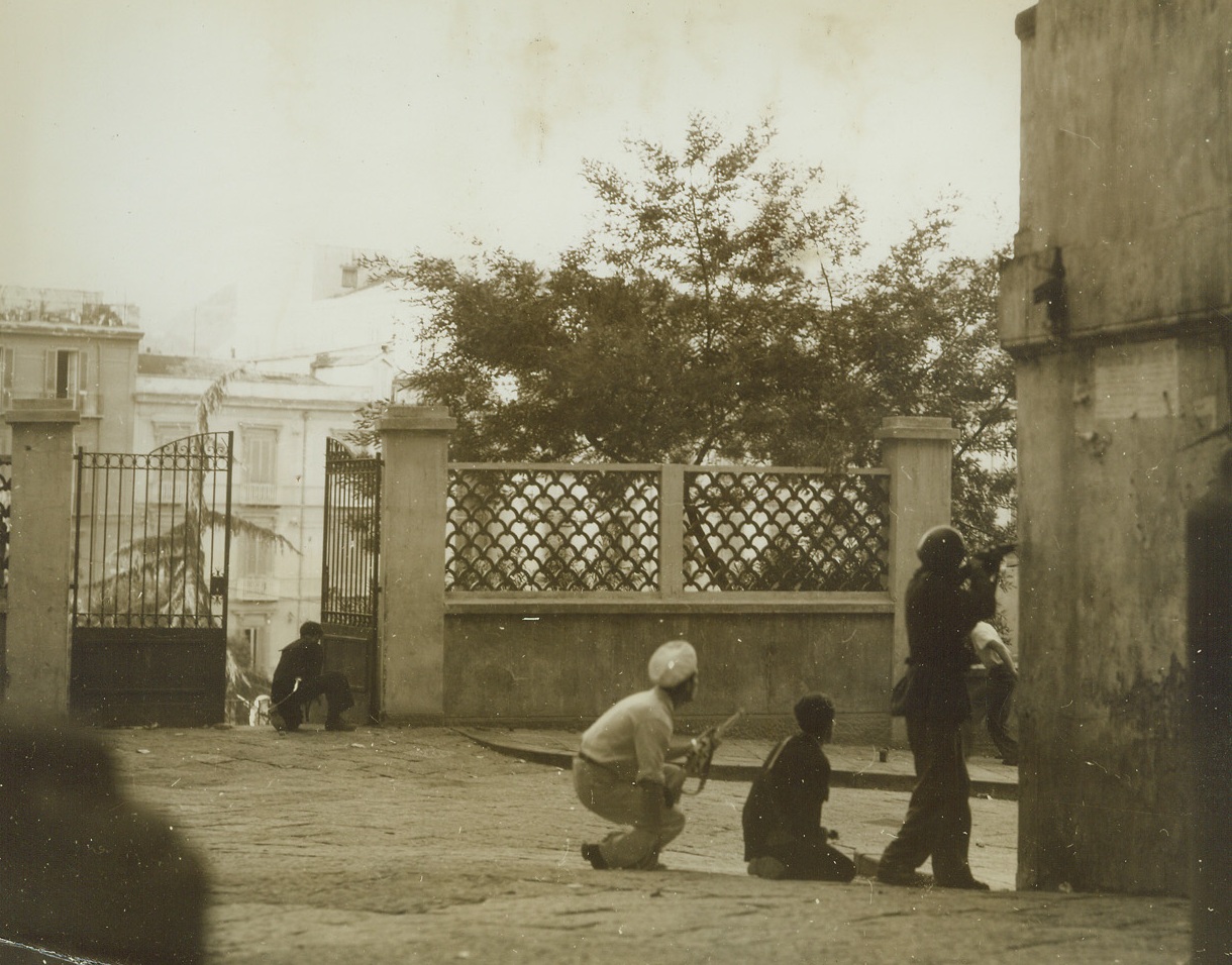 ITALIANS BATTLE NAZIS BEFORE YANKS ARRIVE, 10/9/1943. NAPLES, ITALY—Fearless young Italian guerillas battle Nazis and Fascists in the streets of Naples on October 1st, before the arrival of the American 5th Army. U.S. troops later disarmed the democratic youths who paid dearly for their uprising. Credit: Acme photo by Charles Seawood, War Pool Correspondent;