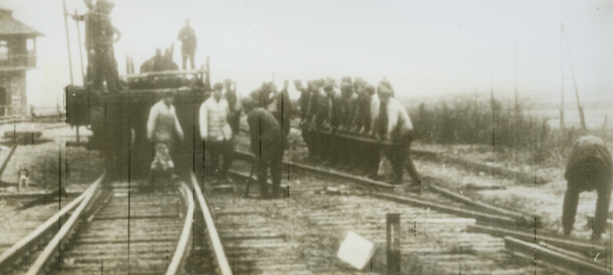 Nazi Strip Act, 10/29/1943. Russia – Stripping the countryside like Japanese beetles would strip a rose bush, German soldiers remove rails from Russian Territory as they retreat before the Red Army. They’ll probably be used in Germany to replace those blown up by well-aimed Allied bombing. Photo radioed from Stockholm today.Credit: ACME Radiophoto;