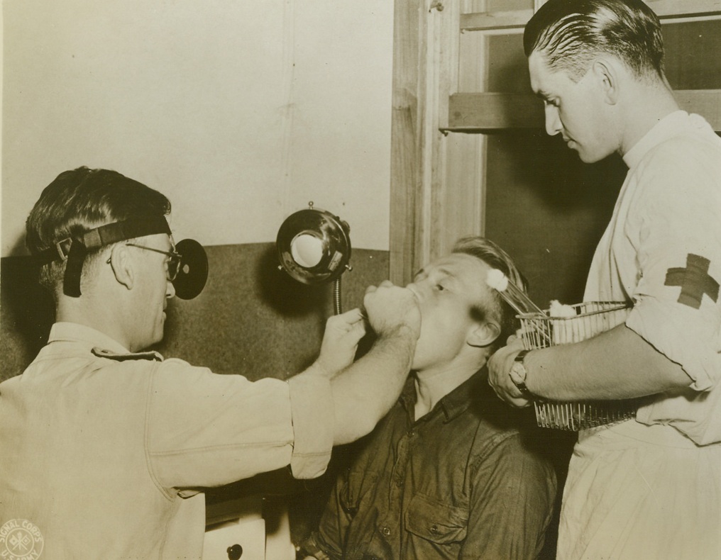 Life at the Largest Nazi Prisoner of War Camp, 10/4/1943. Aliceville, Alabama -- Thousands of German prisoners now occupy miles and miles of guarded territory at Aliceville, Alabama, at the country’s largest internment camp for captured Nazis. Tennis courts, badminton and various ball game facilities are available between the barracks within each compound, each compound containing 1,000 prisoners. A contest in landscaping resulted in beautifully kept green lawns, sculptured animals and patterned flower gardens, while the opportunity to build exercise aids led to the erection of horizontal bars, broad-jump pits and shot-put courses. Very few Nazis have tried to escape, and not one has succeeded. These photos show a few typical scenes at the Aliceville internment camp.;