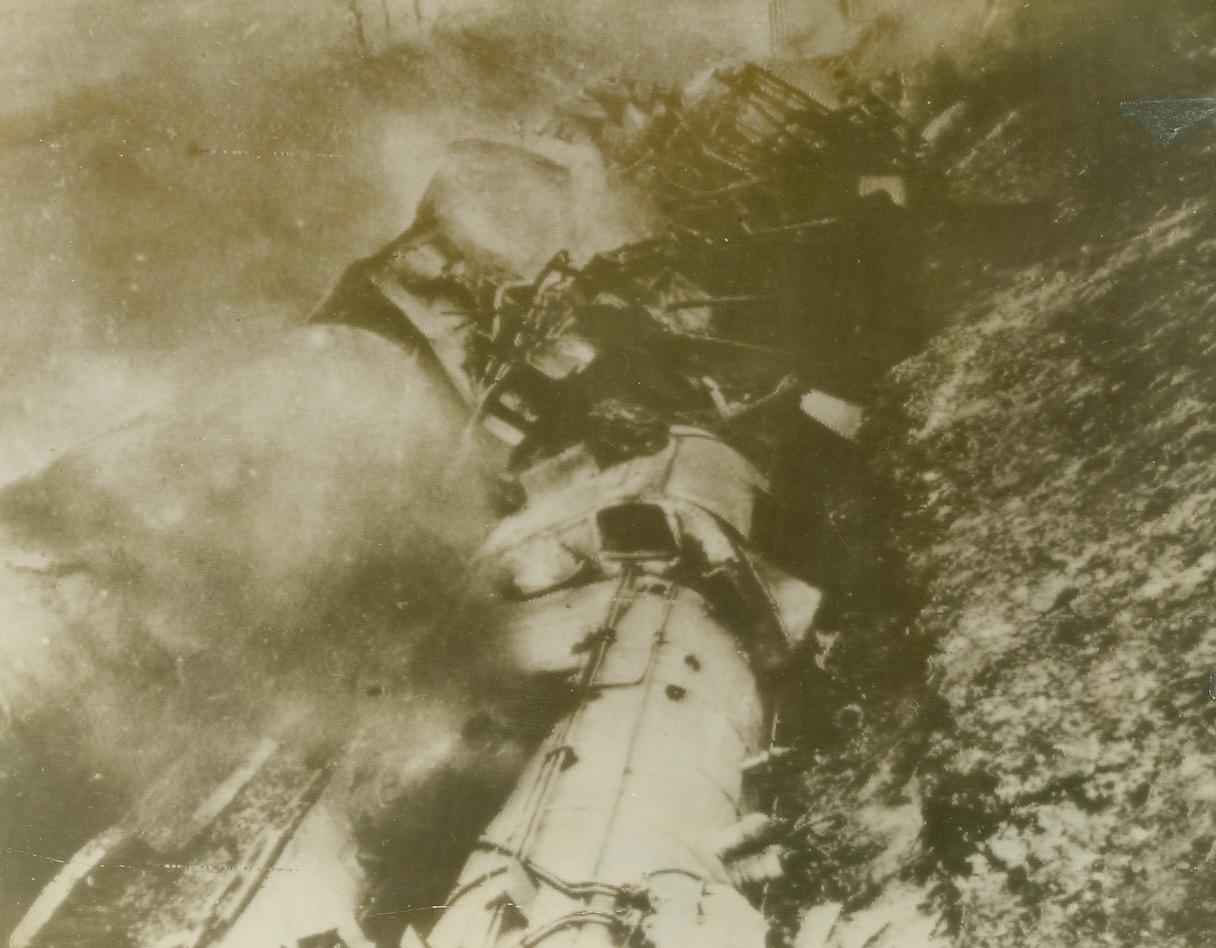 Work of French Patriots, 11/28/1943. Varenne-Le-Grand, France – Derailed and flaming, this Nazi gasoline train was sabotaged by French patriots, in the vicinity of Varenne-Le-Grand, on the night of August 31, 1943. This action cost the Germans 1,200,000 liters of high test aviation gas; ruined the train, which was specially built for fuel transportation in Germany; and halted traffic on the railroad line for five days. Photo radioed to New York today (November 28) from Algiers. Credit: French official photo via OWI Radio-ACME;