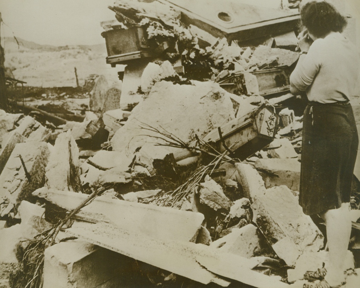 Nazis Desecrate Graveyard, 12/2/1943. BASTIA, CORSICA – A native woman weeps as she views the destruction done by Nazi Demolition squads to this graveyard in Bastia, where members of her family are buried. Germans ruthlessly destroyed buildings and installations in Corsica as they retreated into the corner, where they were beaten by the Allies. Credit Line (OWI Photo from ACME);