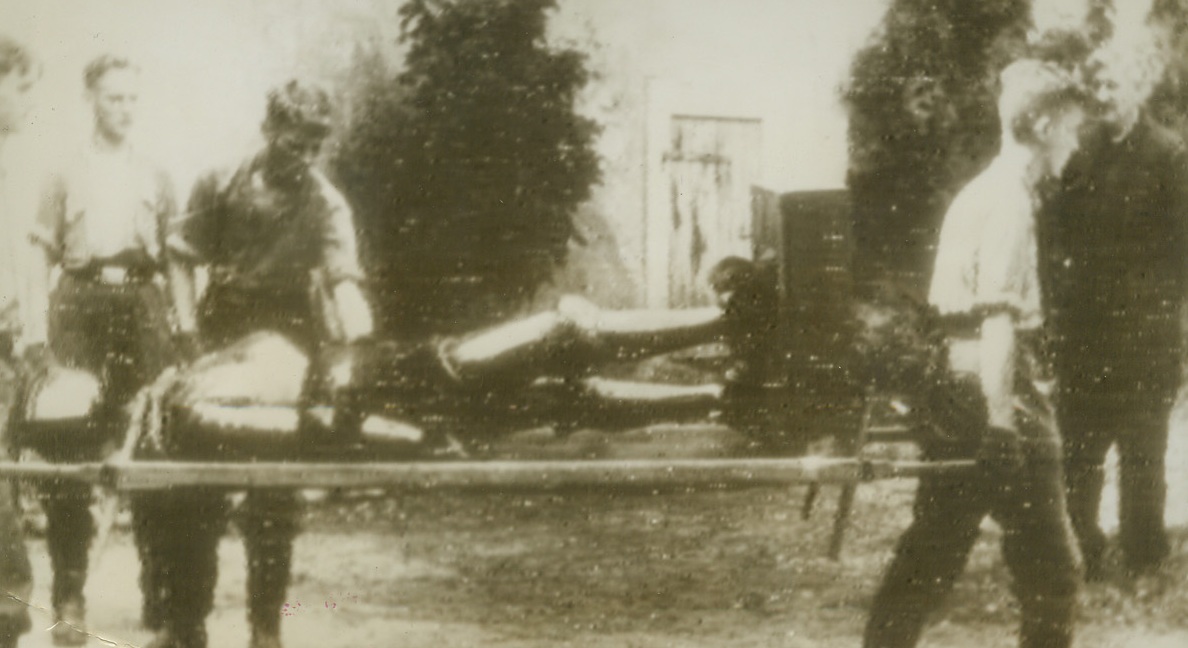 In the Nick of Time, 12/20/1943. BERLIN—Berliners had the right idea when they decided to remove the exhibits form the Zifghaus (Army Museum) last Wednesday because allied bombings hit the structure the next night. Here young boys remove one of the old suits of armour on a stretcher.  Credit: ACME Radiophoto from Stockholm.;