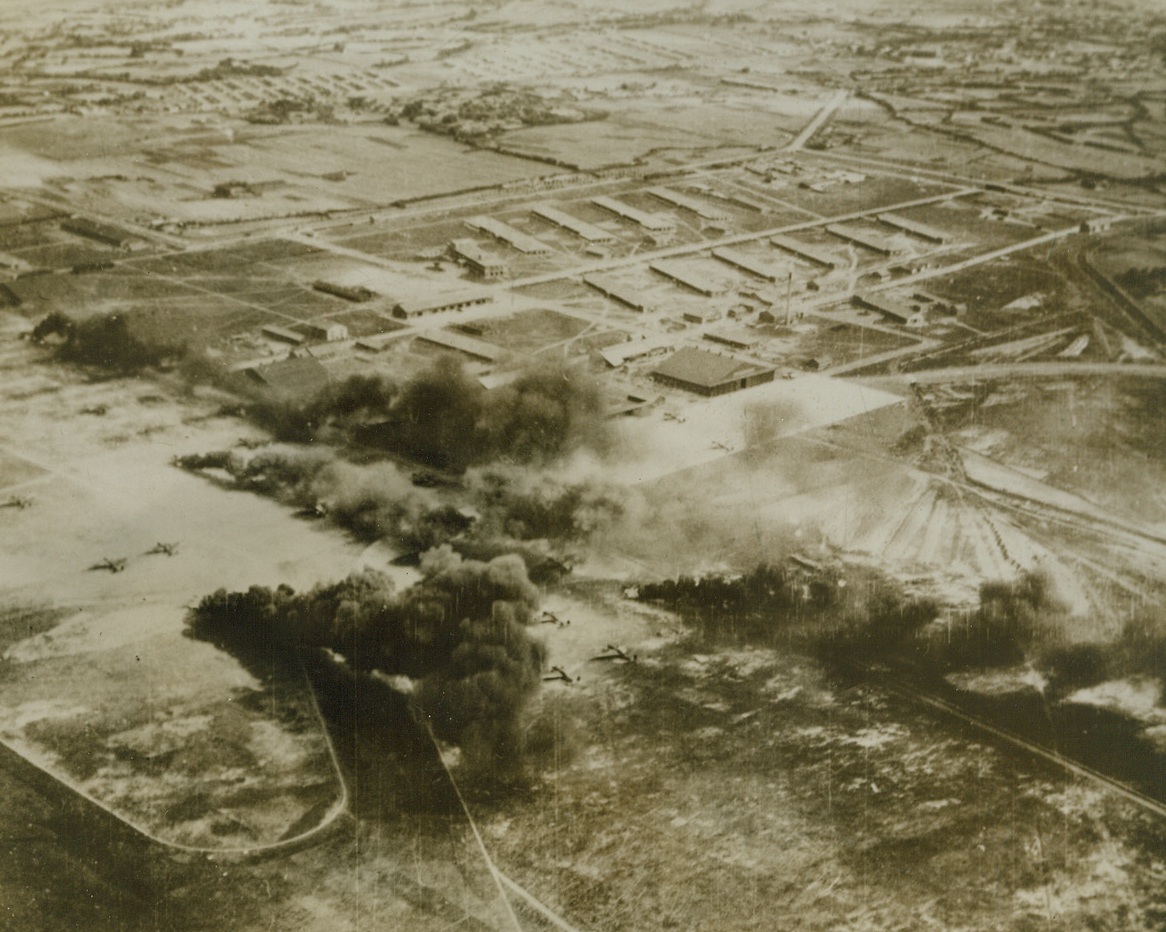 Yanks Hit Japs at Home – (#2), 12/16/1943. Washington, D.C. – This photo, just released in Washington, shows Jap aircraft burning on the Shinchiku Aerodrome on Formosa, during an attack last Thanksgiving Day (1943), by fighters and bombers of the U.S. 14th Army Air Force, which took off from bases in China proper. This photo was taken just after fighter planes swept the target in a low-level strafing attack, which set fire to the Nip aircraft. A short time later, American bombers blasted the airfield and installations with heavy bombs.;