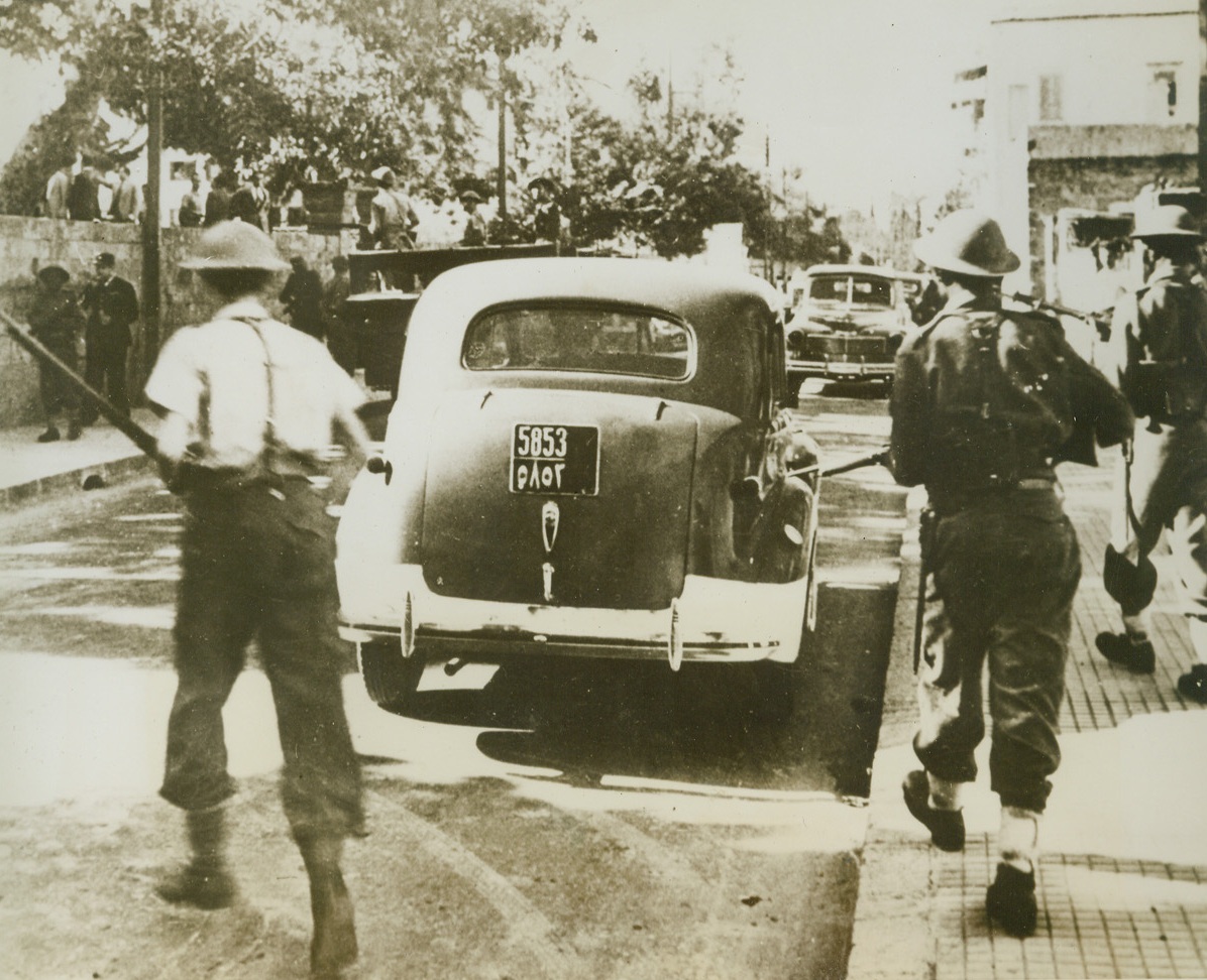 Ready For Trouble, 12/4/1943. Beirut, Lebanon: French troops of the French committee of National liberation easily handle, as shown here, demonstrators who had assembled in protest against the arrest of the President, Premier, some Ministers and some members of the Chamber.  Officials were arrested due to their vote of immediate freedom from French mandate.  Since day of arrest, November 11th, French released them to resolve the crisis.Credit line (ACME);