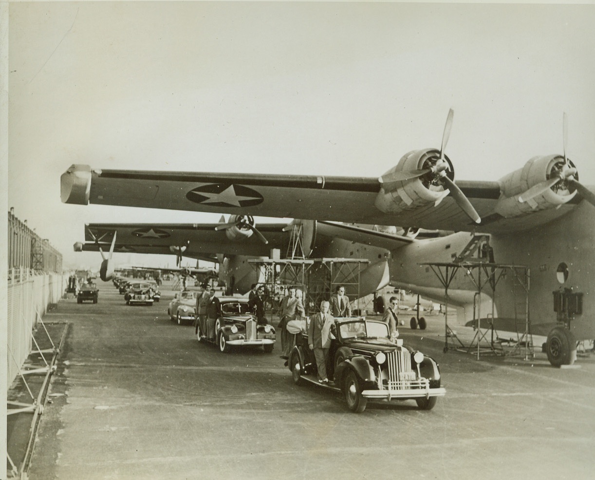 President Views Navy’s Giant Planes, 10/1/1942. San Diego, Calif.—During his tour of the nation’s defenses and war factories, President Roosevelt visited the consolidated aircraft plant in San Diego. Here, he is shown with his party inspecting huge Navy PB2Y patrol bombers. Credit: U.S. Navy photo from ACME.;