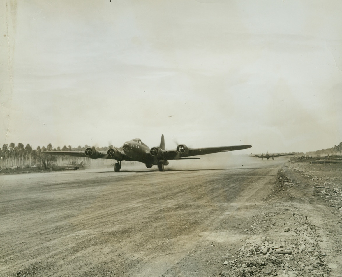 FORTRESSES ON STRATEGIC AIRPORT, 10/17/1942. SOLOMON ISLANDS—here’s why that airport on Guadalcanal Island is being fought for so savagely by U.S. and Jap forces in the Solomons. It’s the only field in the area where Uncle Sam’s Flying Fortresses and other big bombers can take off and land for operations against the enemy. Here two of the big Fortresses roar down the long runway. Credit Line (ACME);