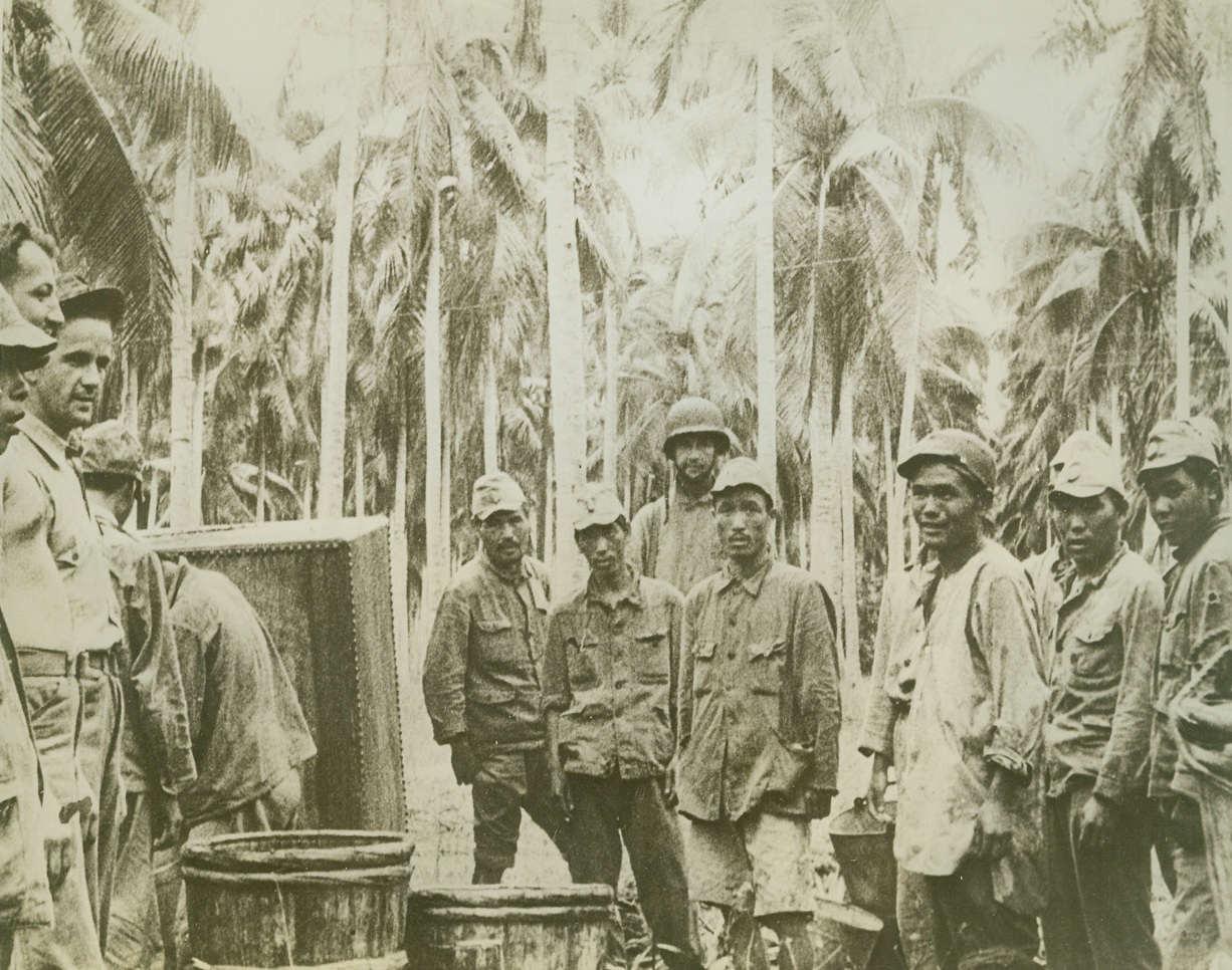 MARINES TAKE JAP PRISONERS AT GUADALCANAL, 10/27/1942. GUADALCANAL, S.I.—Captured after U.S. Marines foiled their attempt to land reinforcements on Guadalcanal, these Japanese prisoners are lined up for examination. They were taken during a heavy enemy invasion attack from the sea. Latest reports a full-fledged battle for control of the strategic island in the Solomon group is now going on. Credit: U.S. Marine Corps photo from Acme;