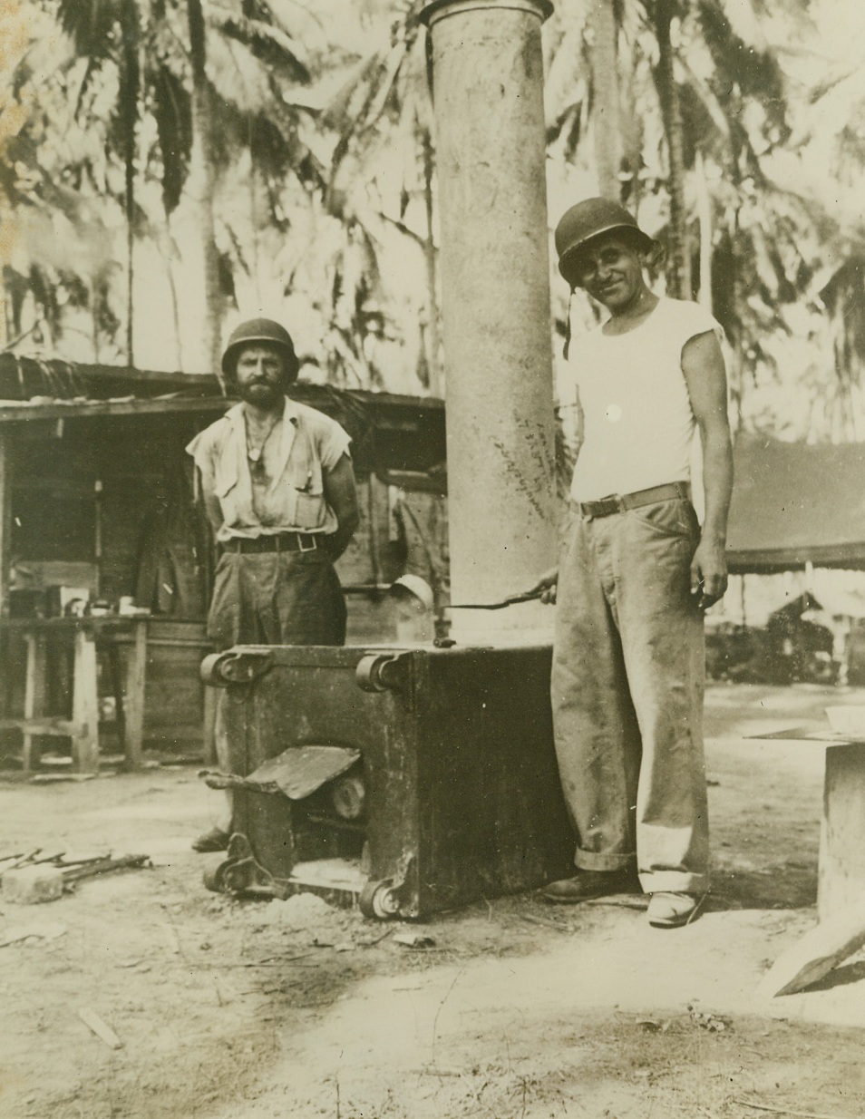 FLAPJACKS A LA GUADALCANAL, 10/30/1942.  GUADALCANAL—Converting a captured safe into a stove, U.S. Marine chefs prepare a batch of pancakes, “Guadalcanal style,” for their hungry colleagues. This photo was made before Jap offensive to regain control of strategic areas taken by American forces in August. Credit Line (Marine Corps Photo from ACME);