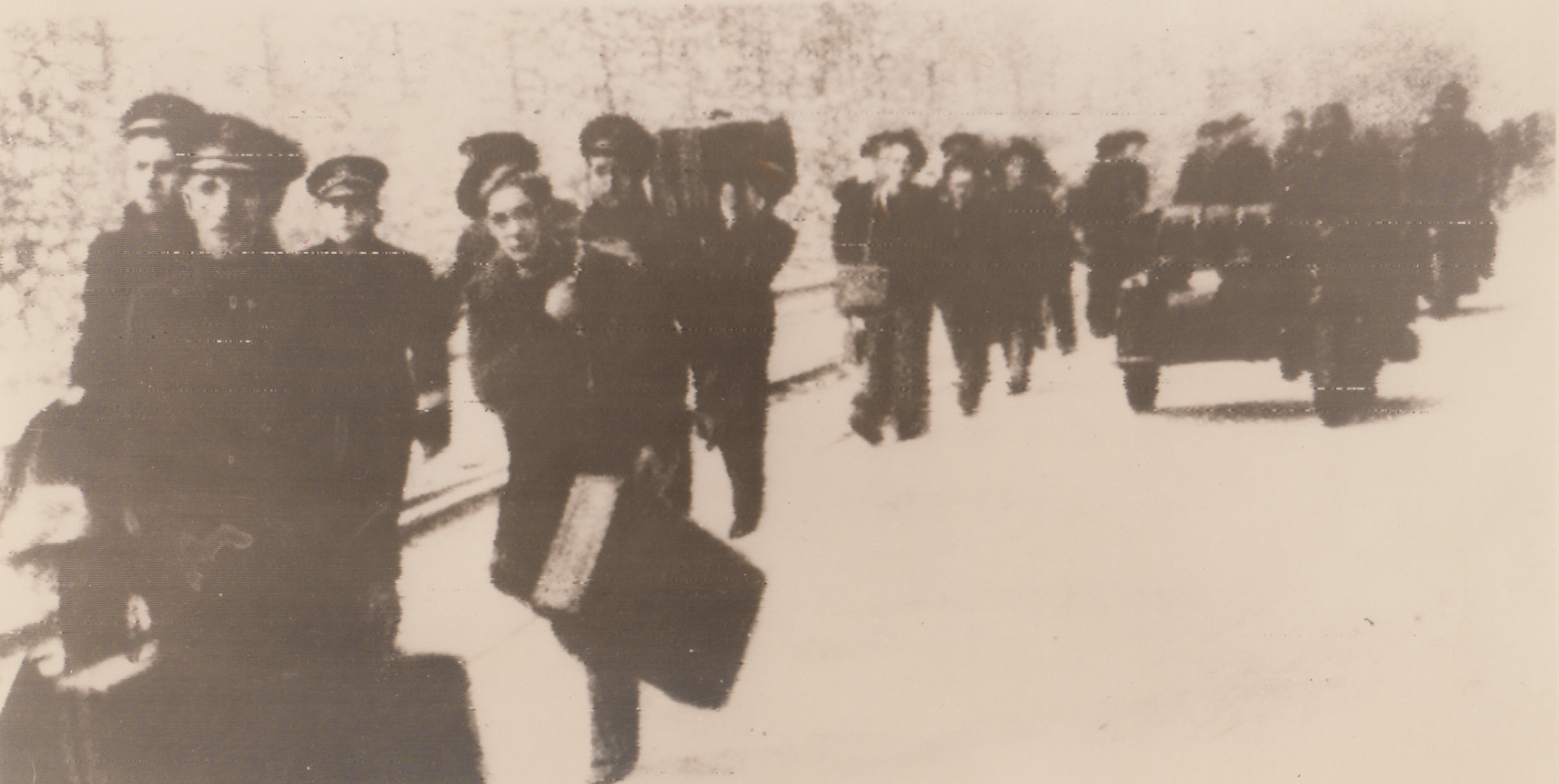 Under Arrest, 12/16/1942. Toulon, France – French sailors march away, under arrest, after the scuttling of the French Fleet at Toulon. Latest reports from London, based on photos taken by the RAF on the day following the scuttling, reveal that virtually the whole fleet was sent to the bottom of Toulon harbor. The battleship, Strasbourg, was not sunk, but aerial photographs show that she has settled and grounded. This exclusive  Radiophoto was received from London. 12/16/42 Credit Line (Acme Radiophoto);