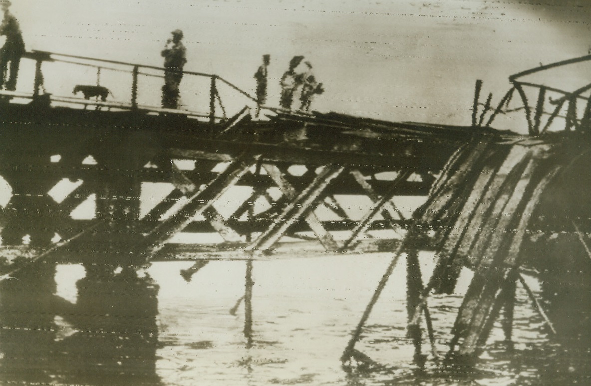 Bridge Blasted in Jap Raid on Darwin, 3/7/1942. Port Darwin, Australia – This bridge was blasted by Jap planes which raided Port Darwin, on Australia’s Northern coast.  Photo was radioed to London and relayed by radio to New York today. Credit ACME Radio photo;