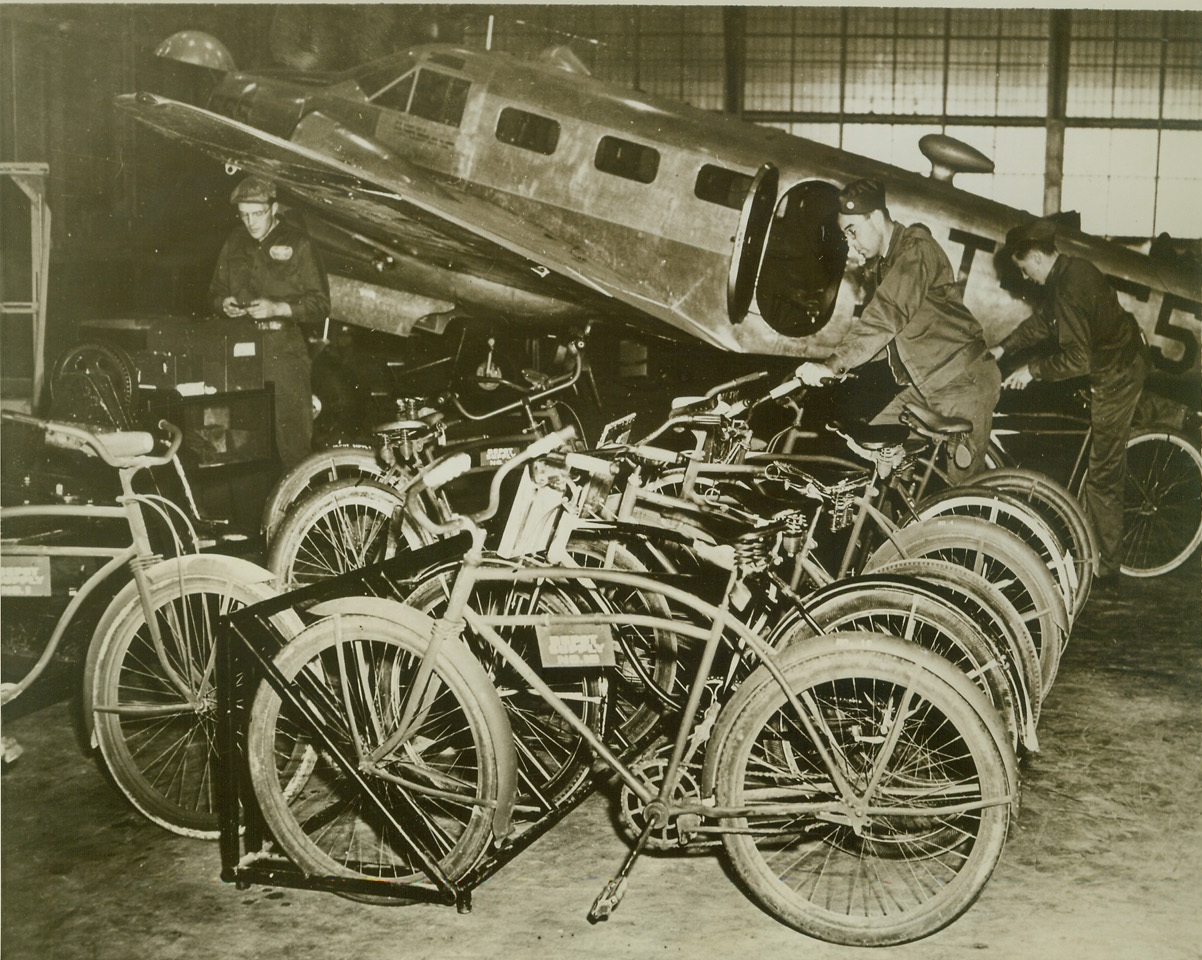 Uncle Sam’s Soldiers Conserve Gasoline, 5/7/1942. McClellan Field, Calif.—America’s fighting men at the Sacramento Air Depot are “all out” in their effort to help Uncle Sam conserve rubber, gasoline and oil. Every available bicycle in this region was bought up by the military personnel and by thousands of civilian war workers immediately after Pearl Harbor. Here, bikes are shown parked in their racks, purposely placed near planes being serviced, by the crews that own them. Credit: U.S. Army Signal Corps from ACME.;