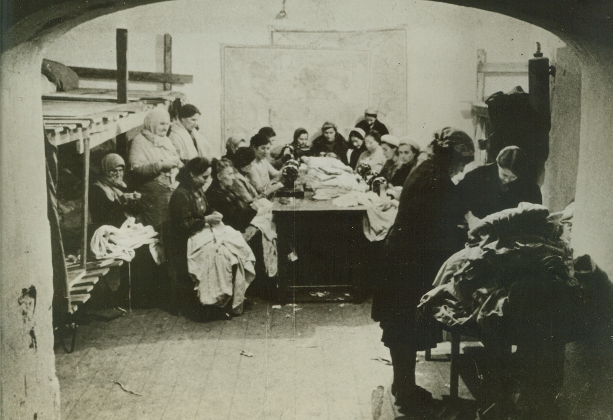 Women Behind Sevastopol’s Heroes, 5/18/1942. Sevastopol – Women are above shown sewing warm clothing for the heroic defenders of Sevastopol while resting in a bomb shelter. The heroic defense of Sevastopol and the entire Crimea will rank high in the military annals of the world, when the final story is told. The town is one of the huge stumbling blocks Hitler’s hordes must overcome before they can clean out the Crimea and move in on the Caucasas, but the defenders of the town have vowed that the Nazis will never pass. (Passed by Censors). Credit: ACME;