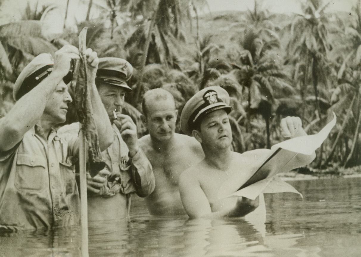 ESTABLISHING BASE ON SOUTH PACIFIC ISLE, 6/9/1942. SOMEWHERE IN THE SOUTH PACIFIC—The work required, the supplies necessary and the means by which Uncle Sam’s Army, Navy and Marine Corps move in on a South Pacific Island to establish a new base is graphically. Illustrated in this series of photographs just released by the Navy Department. Above, wire mats being laid down by Army and Navy Engineers so that heavy equipment used in establishing the beach head will not bog down in the sand.Credit: OFFICIAL U.S. NAVY PHOTO FROM ACME;