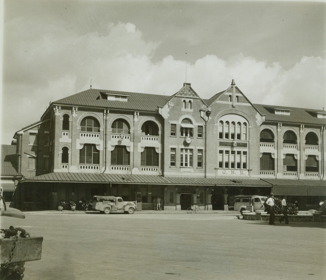 GETS TASTE OF FIRST AIR RAID, 7/26/1942. AUSTRALIA – View of the railway station at Townsville, strategic port and foundry town lying about midway between Sydney and the northern tip of Australia, which last night was raided by a small formation of Japanese flying boats. The raiders, who came in unescorted, dropped their bombs wide of their target and raced for home. It was the first raid on the continental shores of northeastern Australia. Credit: ACME;