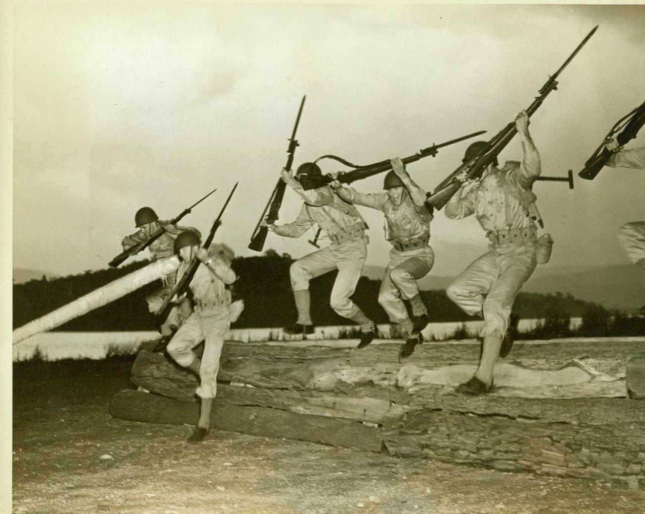 LARGEST WEST POINT CLASS “TOUGHENS UP”, 7/27/1942. WEST POINT, N.Y. – Twelve hundred plebes, the largest class ever to enter the United States Military Academy, answered their first reveille, July 27, and began an intensive course of “toughening up” that would keep the famous Commandos “stepping.” The first echelon of the class arrived July 1 and the remainder on July 15. With their preliminary training over, the plebes started on this new five-week course, which will precede academic work. In this series of photos, the plebes are shown as they were put through their paces the first day of the course. It’s “charge” and “charge hard” – The order of the day, as these plebes go over an assault wall after the “enemy.” Credit: ACME;