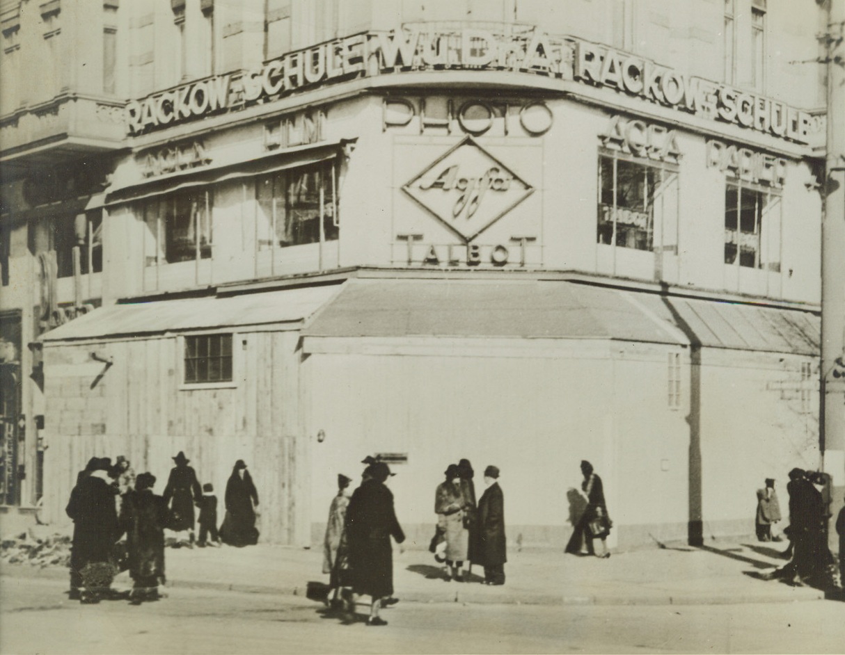 Berlin Prepares—for Trouble at Home,  7/7/1942. BERLIN, GERMANY – This former store of the Singer Sewing Machine Company on Wittenberg Platz, Berlin, is supposed to be an “SS” (Elite Guard) air raid shelter. Actually it is a pillbox, which, in case of demonstrations, could cover the square and the nearby subway station with its machine guns.Credit: (ACME);