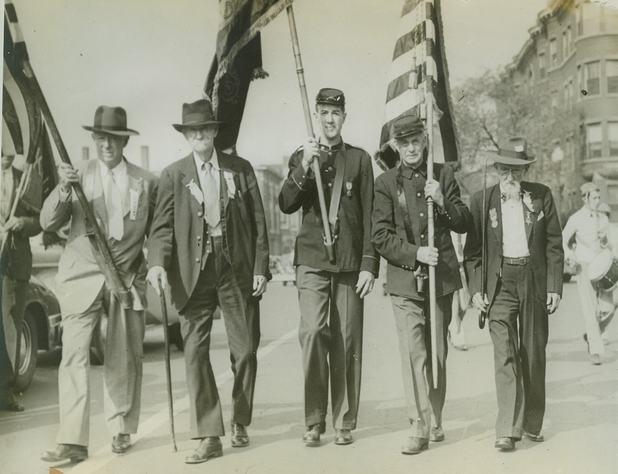 G.A.R. Hold 76th National Encampment Parade, 9/16/1942. Indianapolis, Ind.: Although most of the sixty members of the Grand Army of the Republic rode in the annual encampment parade, four veterans marched the entire distance.  R.R. Graham, 97, of Madisonville, Ky (second from left) and Robert Barrett of Princeton, Ky. (right), two of the veterans who marched are shown with their sons of Civil War escorts (left to right) C.C Holstner, B.R. Green and David Wasser. Credit line (ACME;