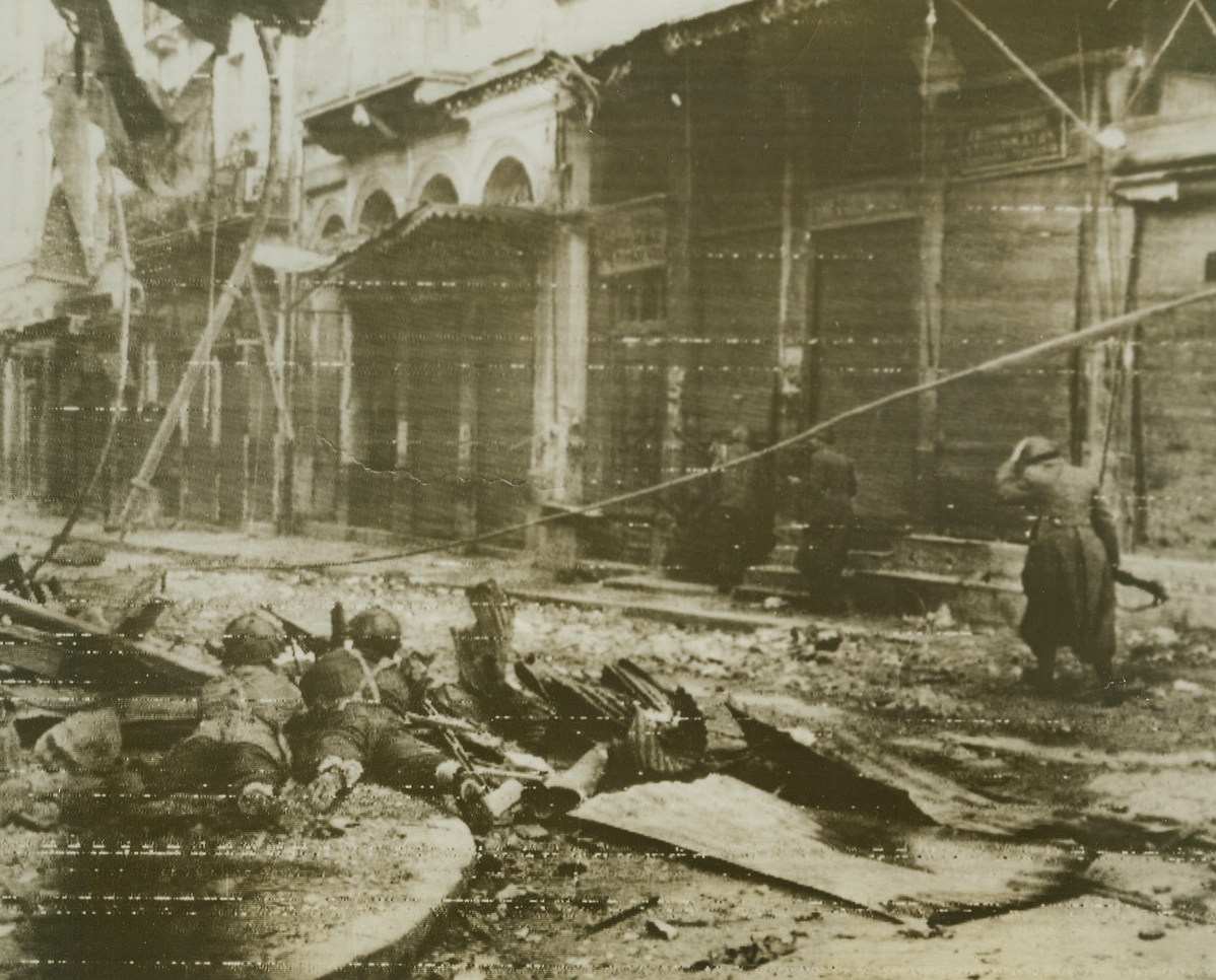 Fight in Streets of Athens, 12/27/1944. GREECE – British paratroopers and Greek policemen advance over shell-torn streets in Athens under constant fire by ELAS forces. This is one of the first pictures from the area showing the extent of damage caused by fighting between British forces and Greek ELAS troops in Athens.Credit (OWI Radiophoto from Acme);