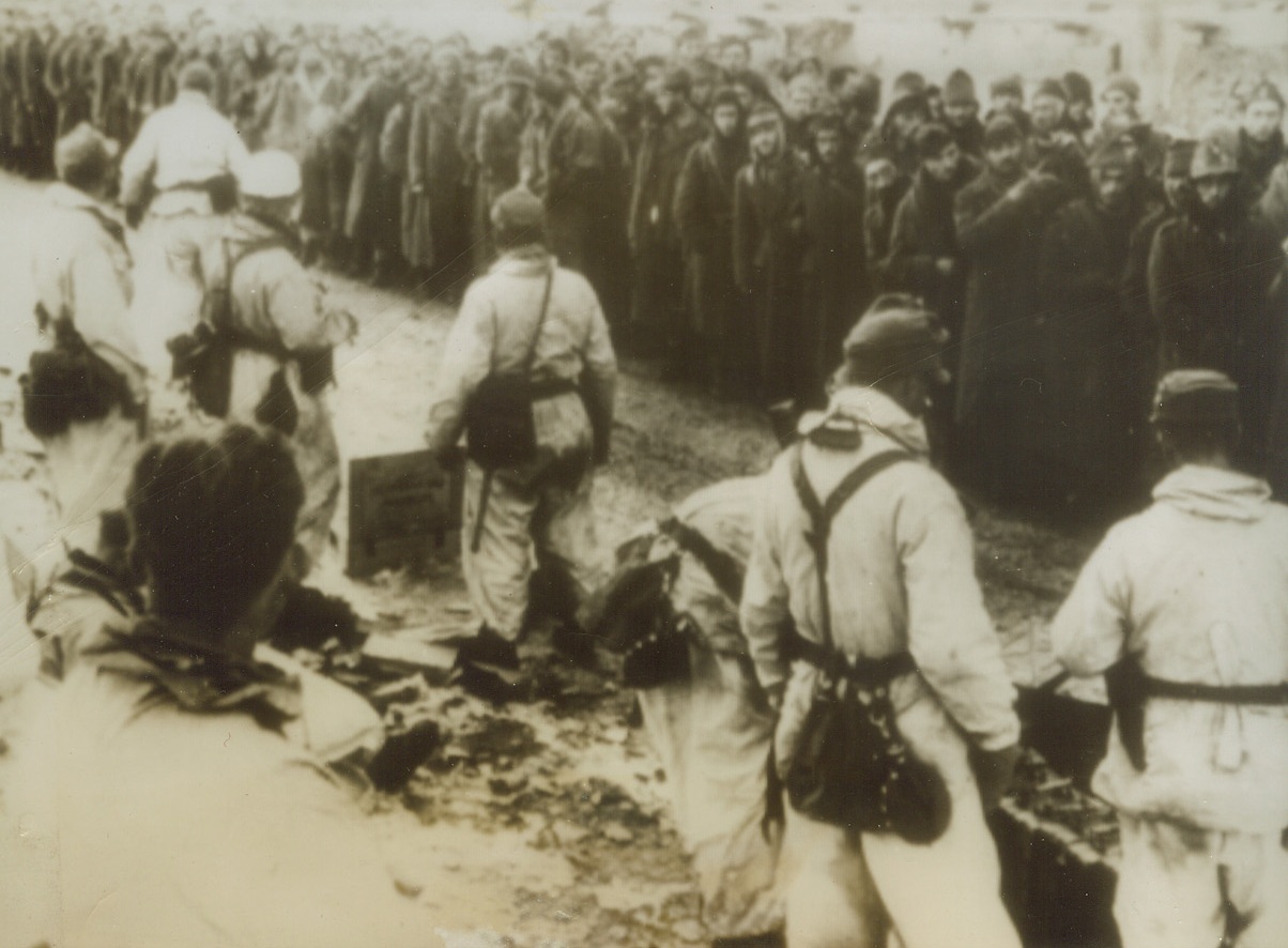 Italian’s Prisoners of Germans, 1/5/1944. BOSNIA—Several months ago we stopped seeing pictures of Italian prisoners taken by Allies when their country capitulated and joined forces with us. Now Italians are being taken prisoner by their former Allies, the Nazis. Here, according to the German caption, is an assembly station of Badoglio troops who were taken prisoner in Bosnia. Photo radioed from Stockholm. Credit: ACME RADIOPHOTO.;