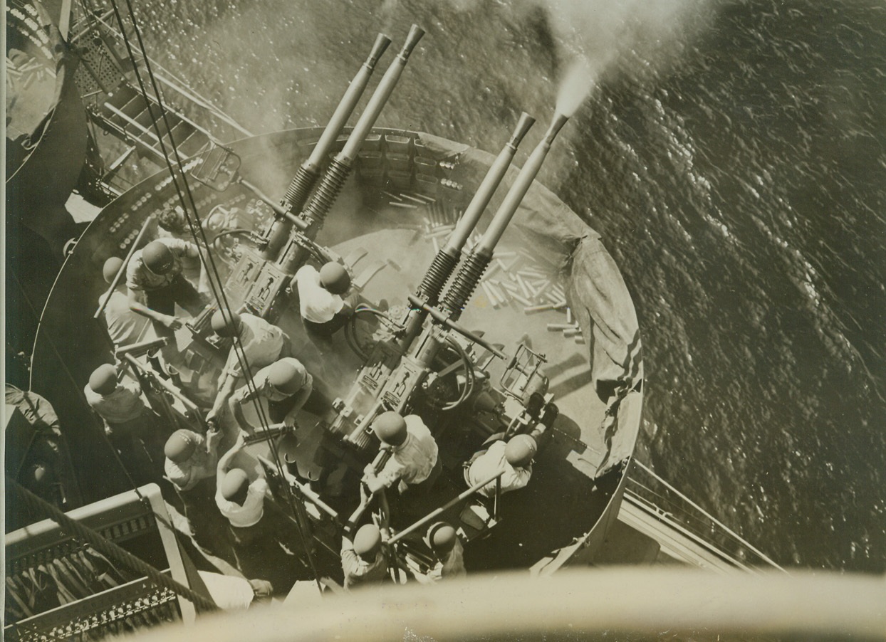 Shakedown Cruise, 1/31/1944. AT SEA -- A vital part of the training of men who fight at sea is the shakedown cruise, the run on which embryo sailors try their sea legs, get acquainted with their shipmates, and learn how to operate their ship. A 40mm gun crew, composed of Navy fighters making their shakedown cruise, goes into action against a make-believe enemy in this dramatic photo. Credit: (Official U.S. Navy Photo from ACME);