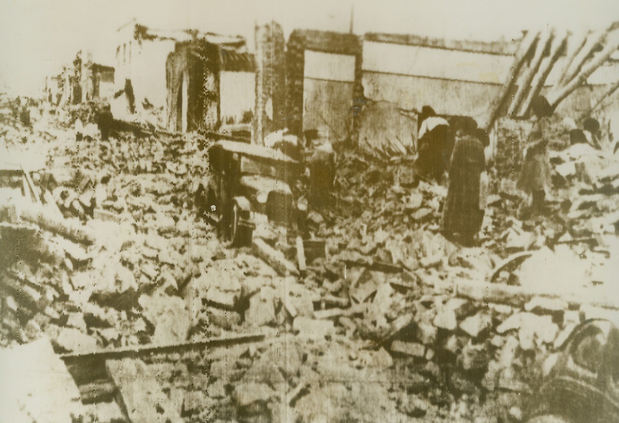 In Wake of Argentine Earthquake, 1/18/1944. Argentina—A group of survivors claw amid the ruins of the once-beautiful city of San Juan, Argentina, seeking loved ones beneath the huge piles of debris left by Saturday’s earthquake. Note cars that evidently had been parked on the street which is completely undistinguishable from other areas. In Buenos Aires, it was estimated that 10,000 were injured and 15,000 to 20,000 missing in the city and its environs. Not more than 20 houses are left standing in the ancient capital. Credit: ACME radiophoto.;