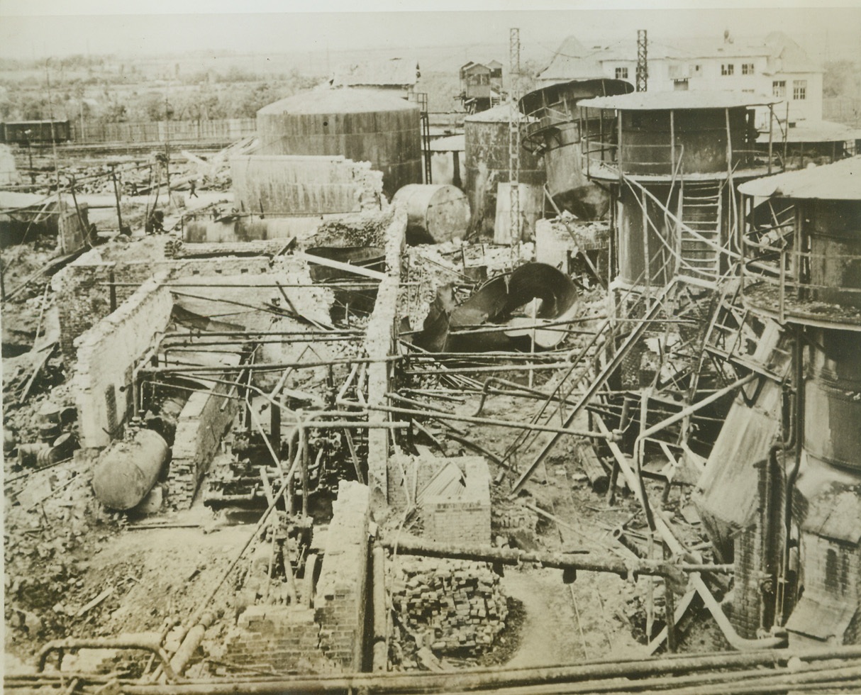 The Big “Leak” in Nazis Gas Tank, 10/4/1944. Rumania – This photo, just received, shows the devastation dropped on the Concordia Vega refinery at Ploesti, one of the installations smashed by some 13,000 tons of Allied bombs in 23 large-scale attacks. Above, little more than scrap metal remains of this plant which one helped to keep Hitler’s war machine going. The area is now in Russian hands. Credit: (USAAF Photo from ACME);