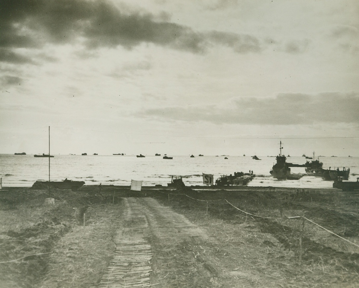 Allied Armada at Leap Frog Landing, 2/3/1944. Italy—A vast flotilla of Allied ships stretches out along the harbor in the Anzio-Nettuno area as troops of the Fifth Army are swiftly landed in the “leap frog” operation. The strategic landing caught the enemy by surprise and resistance was light. Credit: Official U.S. Navy photo from ACME.;