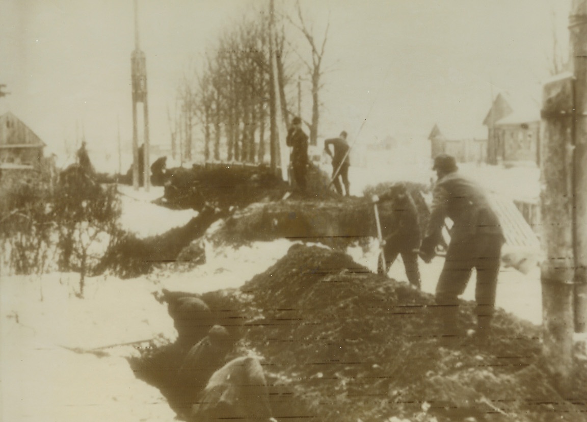 Nazis Dig in on North Russia Front, 2/8/1944. Russia – German soldiers hastily construct trenches on the Northern Russian front in an area named in the German caption as “South of Nevel.”  This is in the sector where the Reds have renewed their offensive and taken more than 80 localities in attacks which may form the Southern prong of a great pincers, the Northern arm sweeping through the Leningrad territory.Credit line (ACME radiophoto);