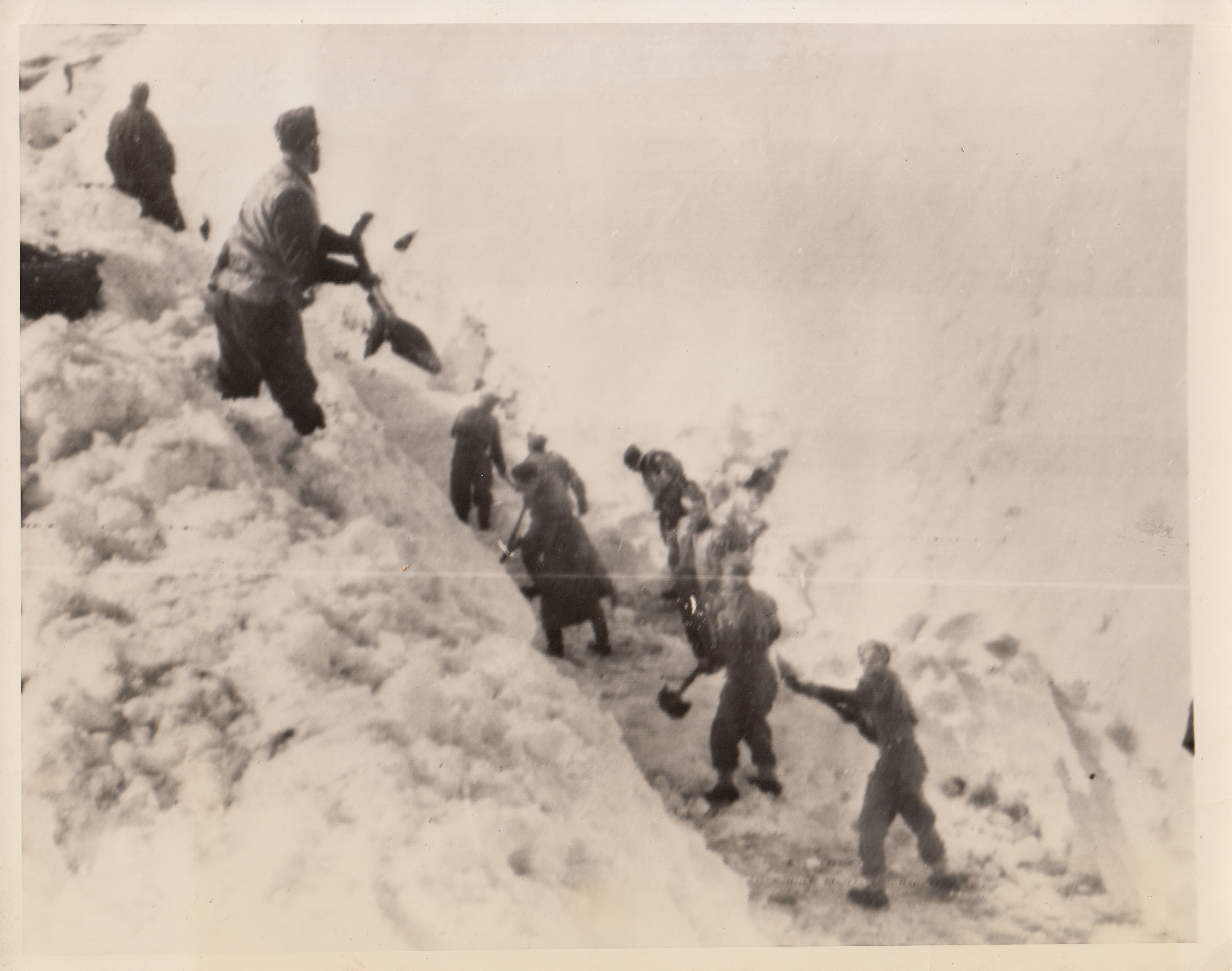 Fighting Polish Sappers, 3/27/1944. ITALY—Polish Sappers, who are fighting the Nazis in Italy are shown digging a roadway from under a heavy coat of snow.;