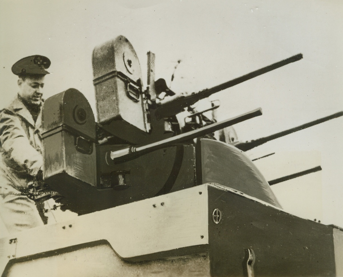 New “Wasp Wagon” Carries a Sting, 3/20/1944. An American soldiers fires the guns on one of the Army’s new mobile anti-aircraft weapon—a half-truck mounting four 50-calibre machine guns. The guns swing together to cover a wide arc of the sky, as well as along the ground. Credit: Official OWI radiophoto from ACME.;