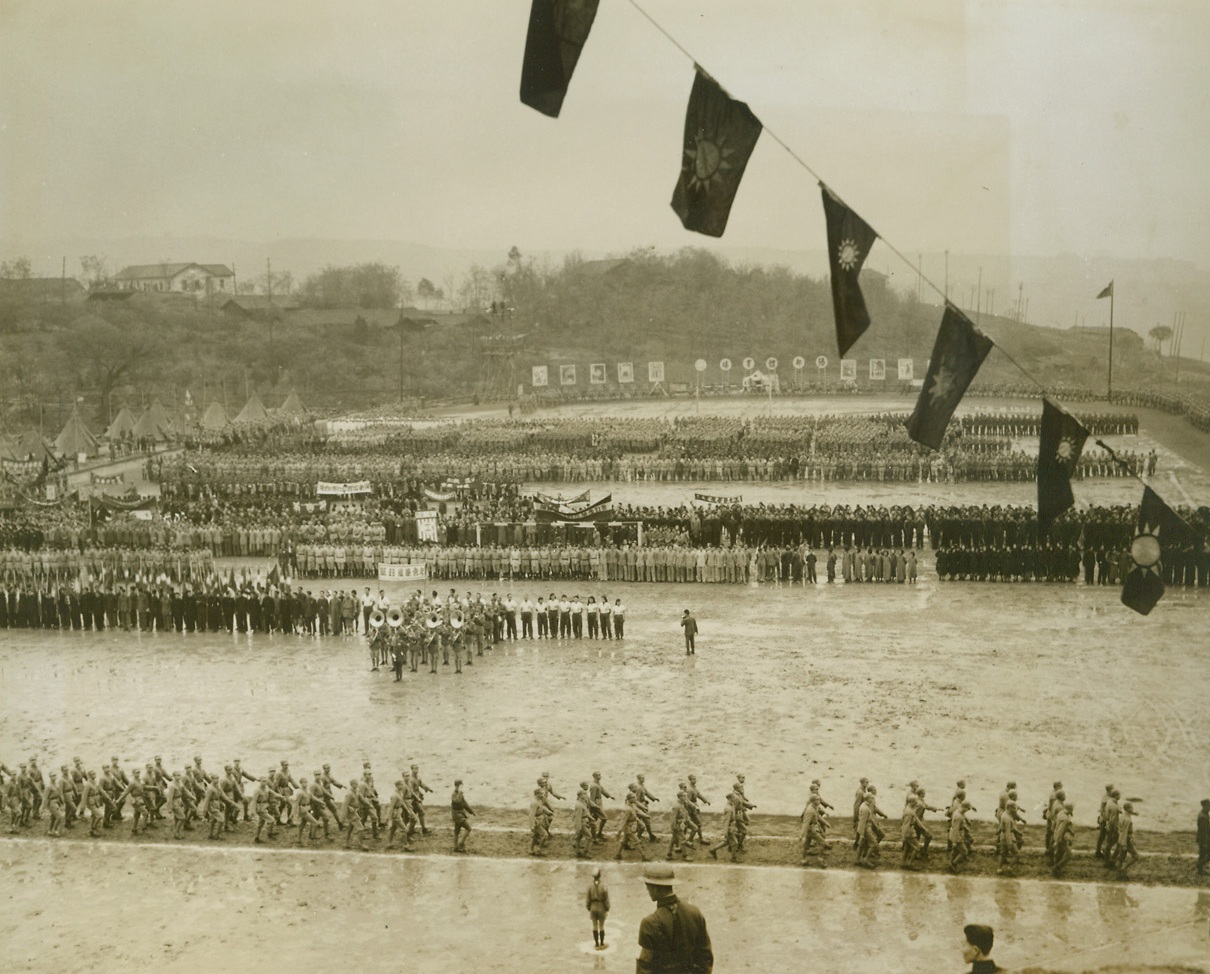 China's Youth On The March, 4/17/1944. CHUNGKING – in celebration of Youth Day, March 28th representatives of all Chin’s young groups gathered at this huge field in Chungking to demonstrate their strength and spirit.  In spite of rainy weather and a water drenched marching ground, the ceremonies were an impressive sight.Credit: ACME.  Photo by Frank Cancellare;