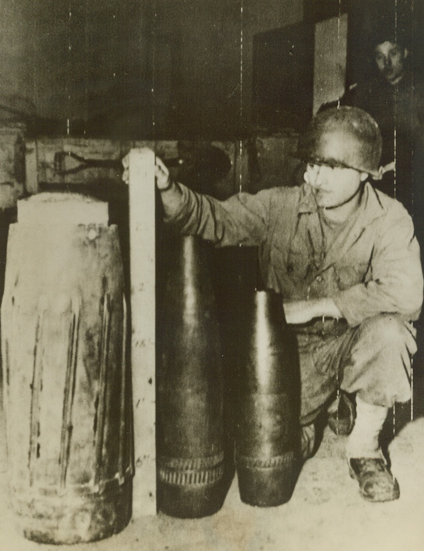 Nazi Duds, 4/14/1944. SOMEWHERE IN ITALY – The 280mm shell at left is the largest German dud to land on an Allied beachhead in Italy. Weighing 550 pounds, it is 11 1/8 inches in diameter and, with its nose cap (not shown) it stands 49 inches high. The dud is shown with two other shells, a 170mm and a 150mm, which landed without exploding. Credit (U.S. Army Radiotelephoto from ACME);