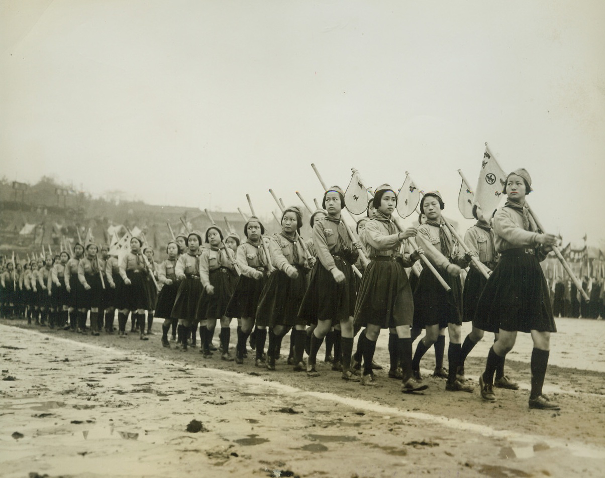 Spirit of Young China, 4/17/1944. Chungking – Serious faces and a military bearing unusual in young girls typify these Chinese girl scouts as they march in review on Youth Day in Chungking, March 28th.  Representatives of all China’s youth groups took part in the demonstration.Credit Line (ACME photo by Frank Cancellare War Pool Correspondent);