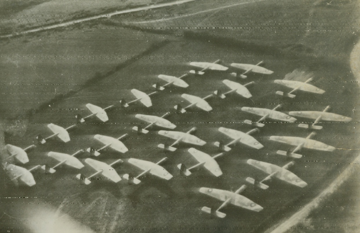 Invasion Rehearsal, 4/24/1944. London – Thousands of British glider and parachute troops staged one of the biggest maneuvers yet held in cooperation with the Royal Air Force and American troops poised for the invasion of western Europe. Air Chief Marshal Sir Arthur Tedder and other high British and American officers watched the operation, held somewhere in England while the Nazis were frantically second-guessing on the time set for D-Day. A group of “Horsa” gliders are shown being moved to take-off. Credit: ACME Radiophoto;