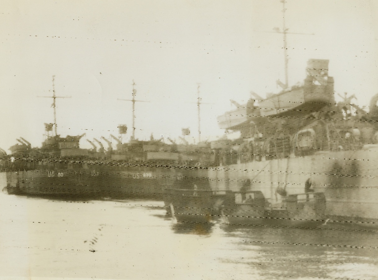 Invasion Ships Mass Off British Coast, 5/16/1944. England – This photo, radioed today from London, shows landing craft of all types massed off the British coast in readiness for the coming invasion. It was reported that the tremendous fleet consisted of large concentrations of transport ships every kind of landing vessel. It is said to be the largest number of ships afloat off the British coast since the Dunkerque evacuation. Credit: ACME Radiophoto;