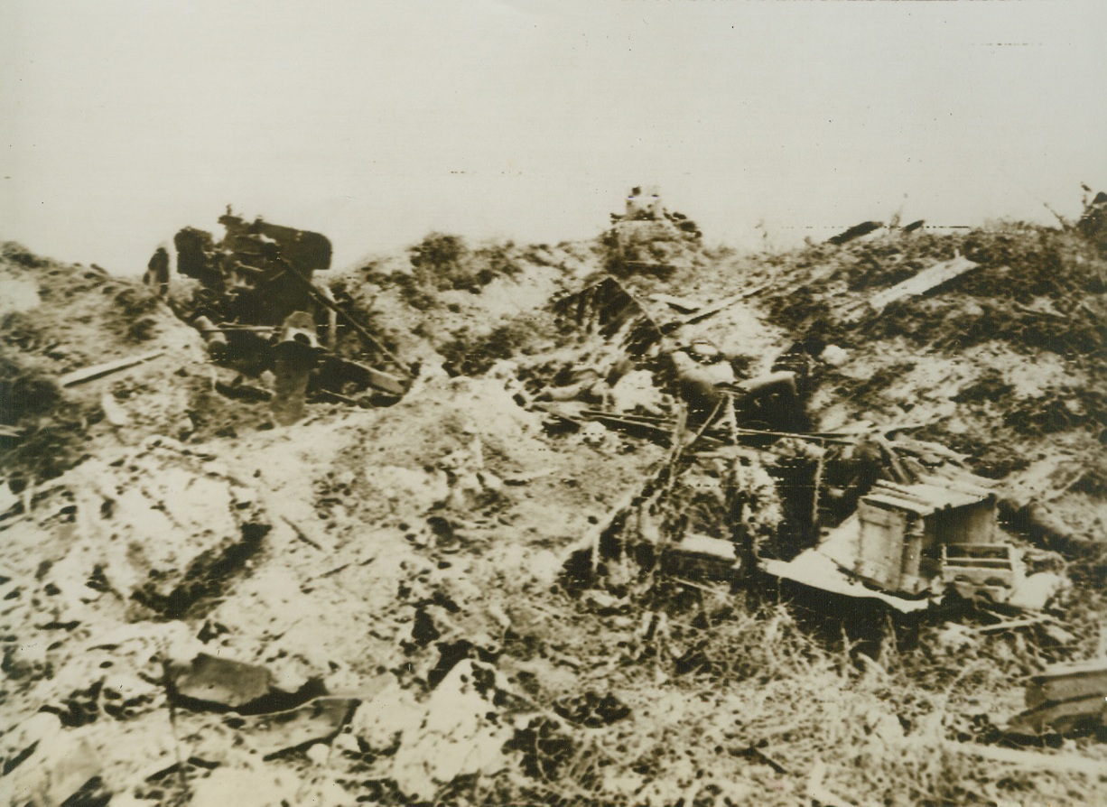 n the Wake of Yank Advance,, 6/24/1944. Saipan – Wreckage and dead Japs mark the path of advance Yank troops have made on Saipan. Almost unopposed today American patrols penetrated into the capital city of the Japanese Marianas. The entire southwestern section of the island below the airfield of Aslito has been turned into a mighty artillery base which continually hurls shells into Jap positions. Credit: Signal Corps Radiotelephoto from ACME;