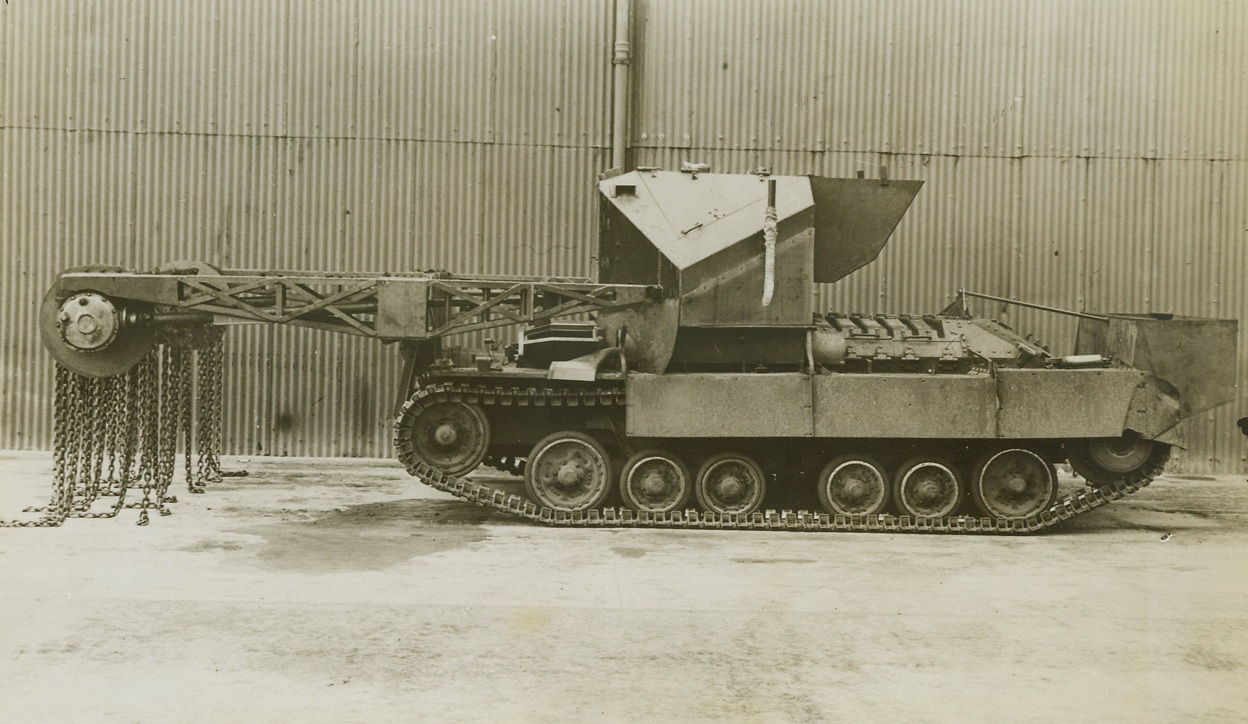 PATH BEATER, 6/29/1944. An Allied secret weapon is the British flail tank called the “Scorpion.” The tank is equipped with chains extended from a boom, which revolve rapidly beating the ground ahead and exploding mines planted by the Nazis. Moving forward in formation the tanks clear the way for advancing infantrymen and supporting vehicles. Credit (British Official Photo from ACME);