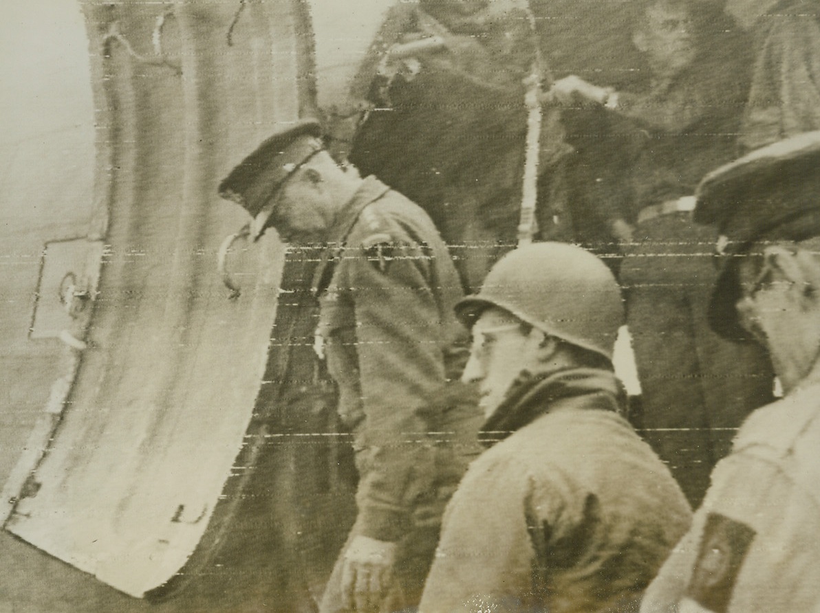 LOOKS GOOD FROM THE AIR, 6/13/1944. FRANCE—Gen. Dwight Eisenhower steps down from a plane on the French beachhead after viewing the progress of the invasion from the air. According to latest reports, the Allies have moved up the Cherbourg Peninsula to capture Montebourg, 14 miles southeast of Cherbourg, key port on the tip of the peninsula. Three villages were also captured by another American column moving up the main Paris Cherbourg highway. Credit (Signal Corps Radiotelephoto from ACME);